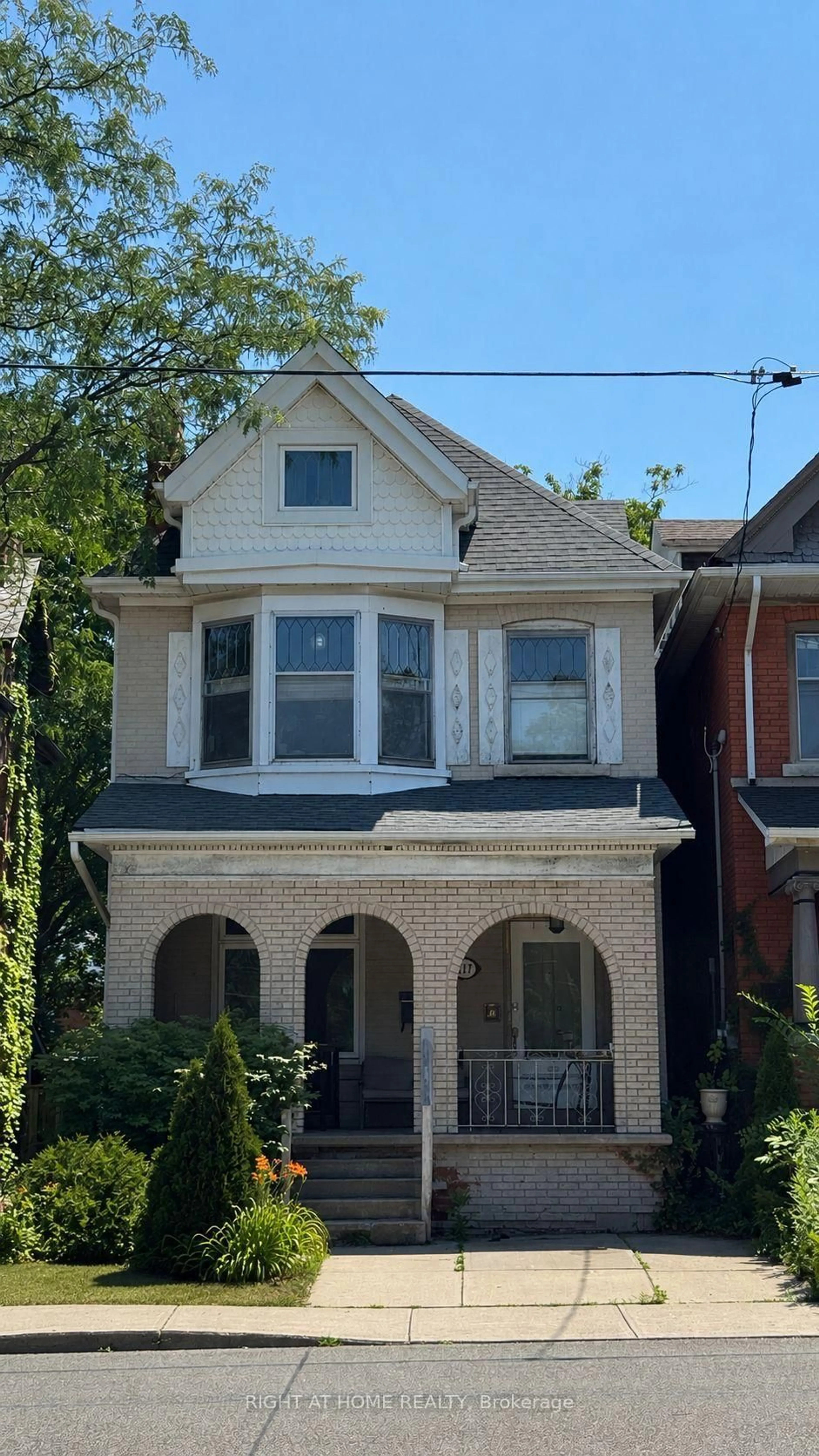 Home with brick exterior material, street for 317 Queen St, Hamilton Ontario L8P 3T6
