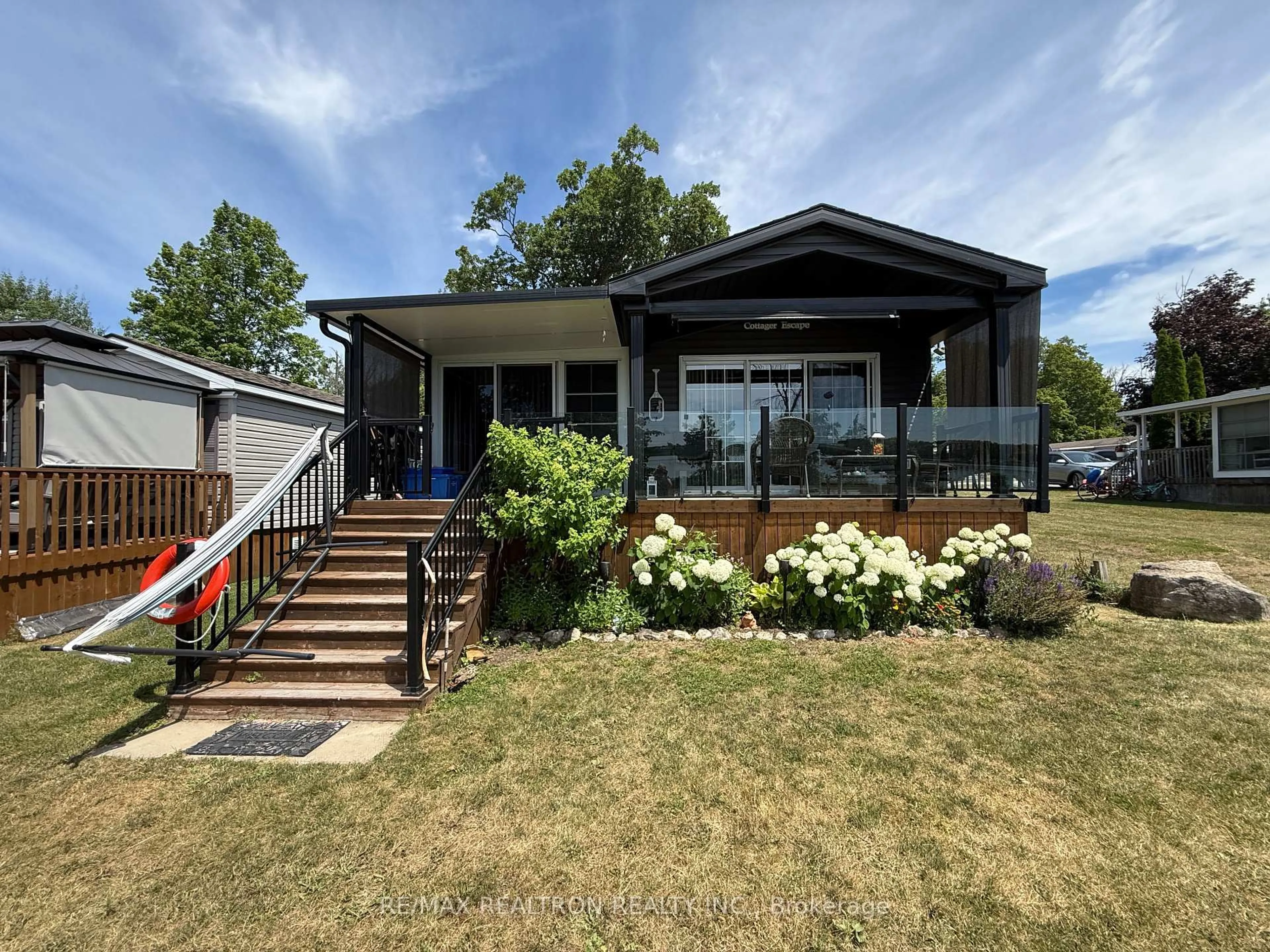 Home with vinyl exterior material, street for 171 Woodland Estate Rd #17 Lakeview Dr, Trent Hills Ontario K0L 1L0