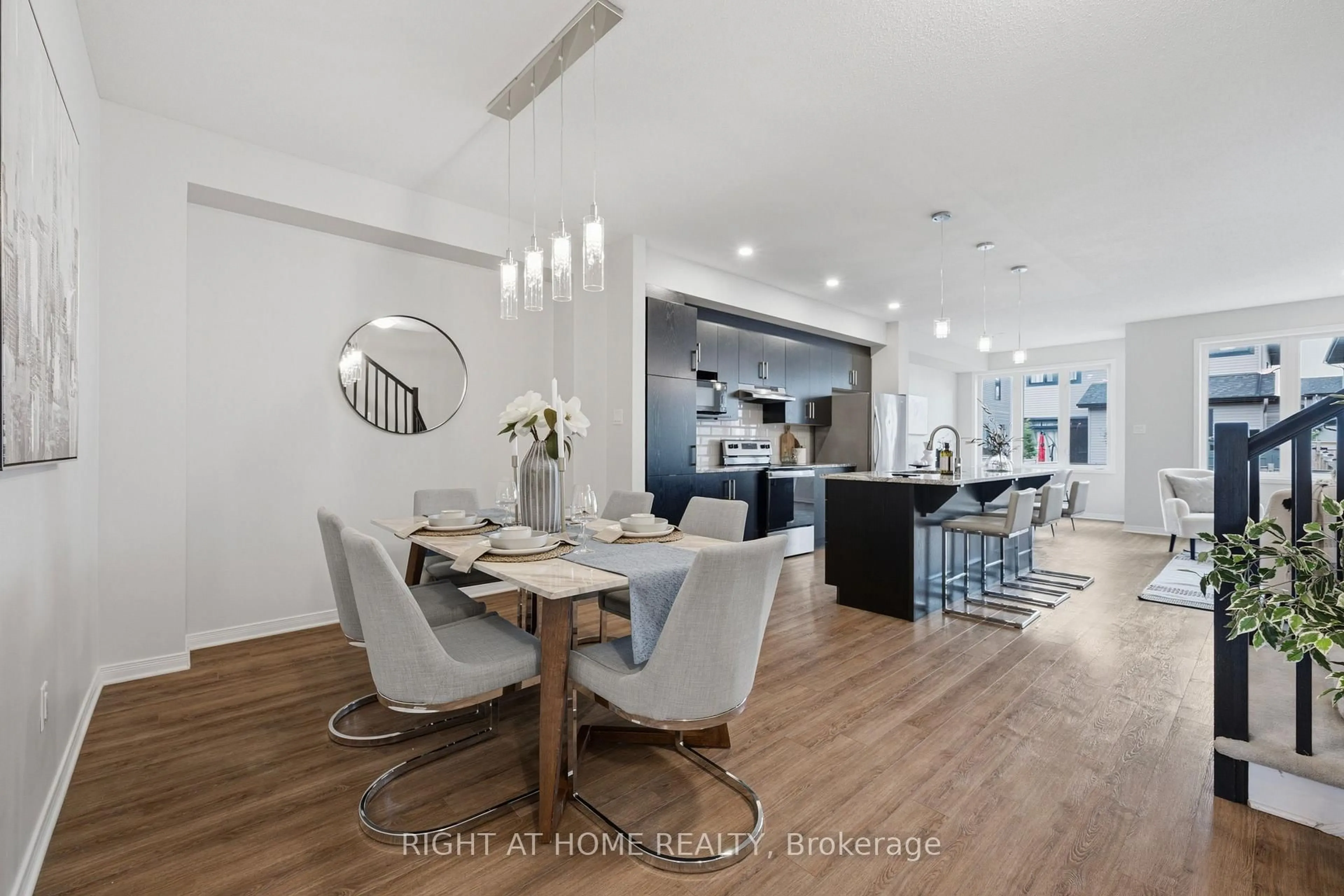 Open concept kitchen, wood/laminate floor for 593 Edenwylde Dr, Stittsville Ontario K2S 2L1
