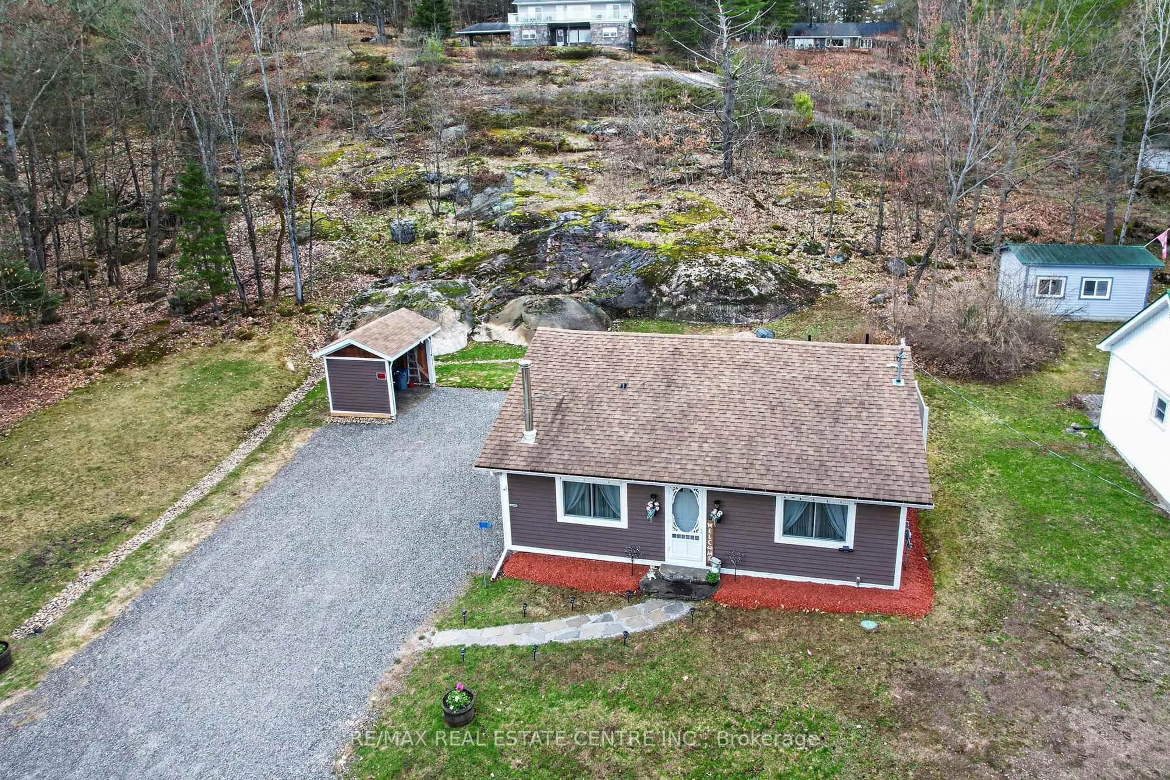 A pic from outside/outdoor area/front of a property/back of a property/a pic from drone, street for 17 MCCLURE Lane, Huntsville Ontario P0B 1L0