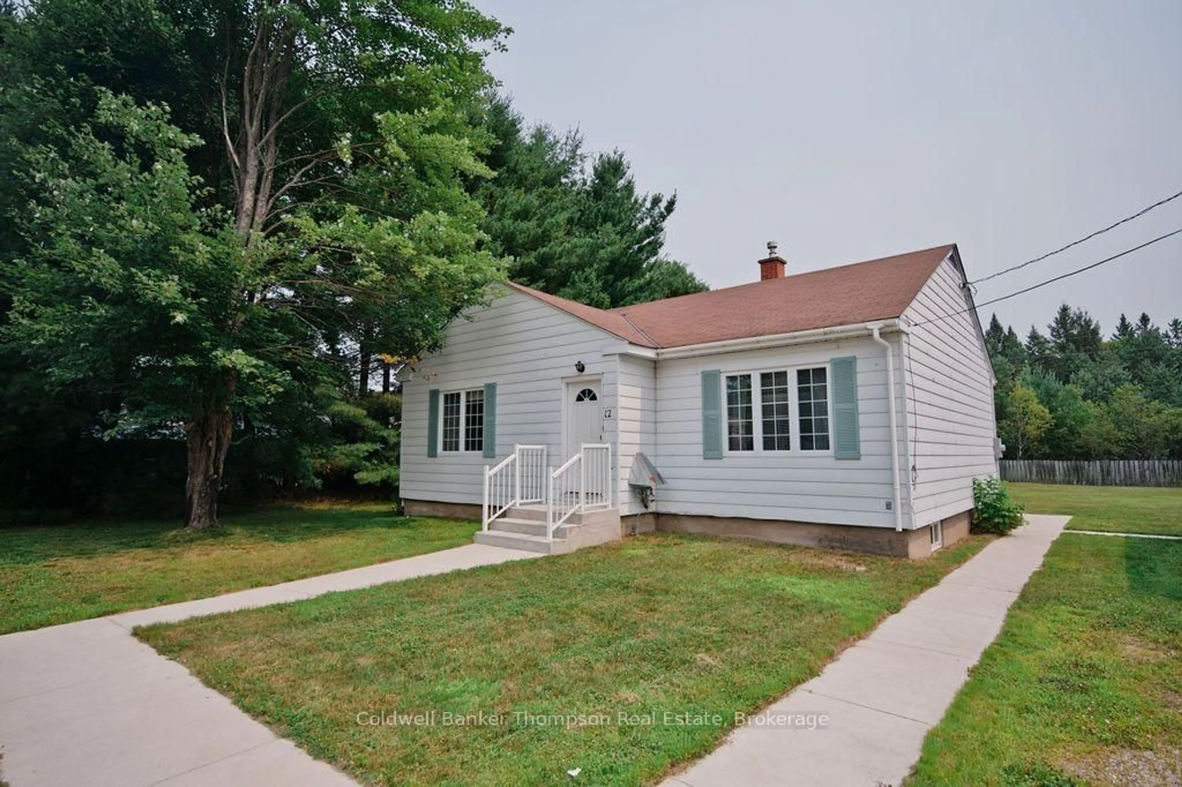 Home with vinyl exterior material, street for 12 Connolly St, South River Ontario P0A 1X0