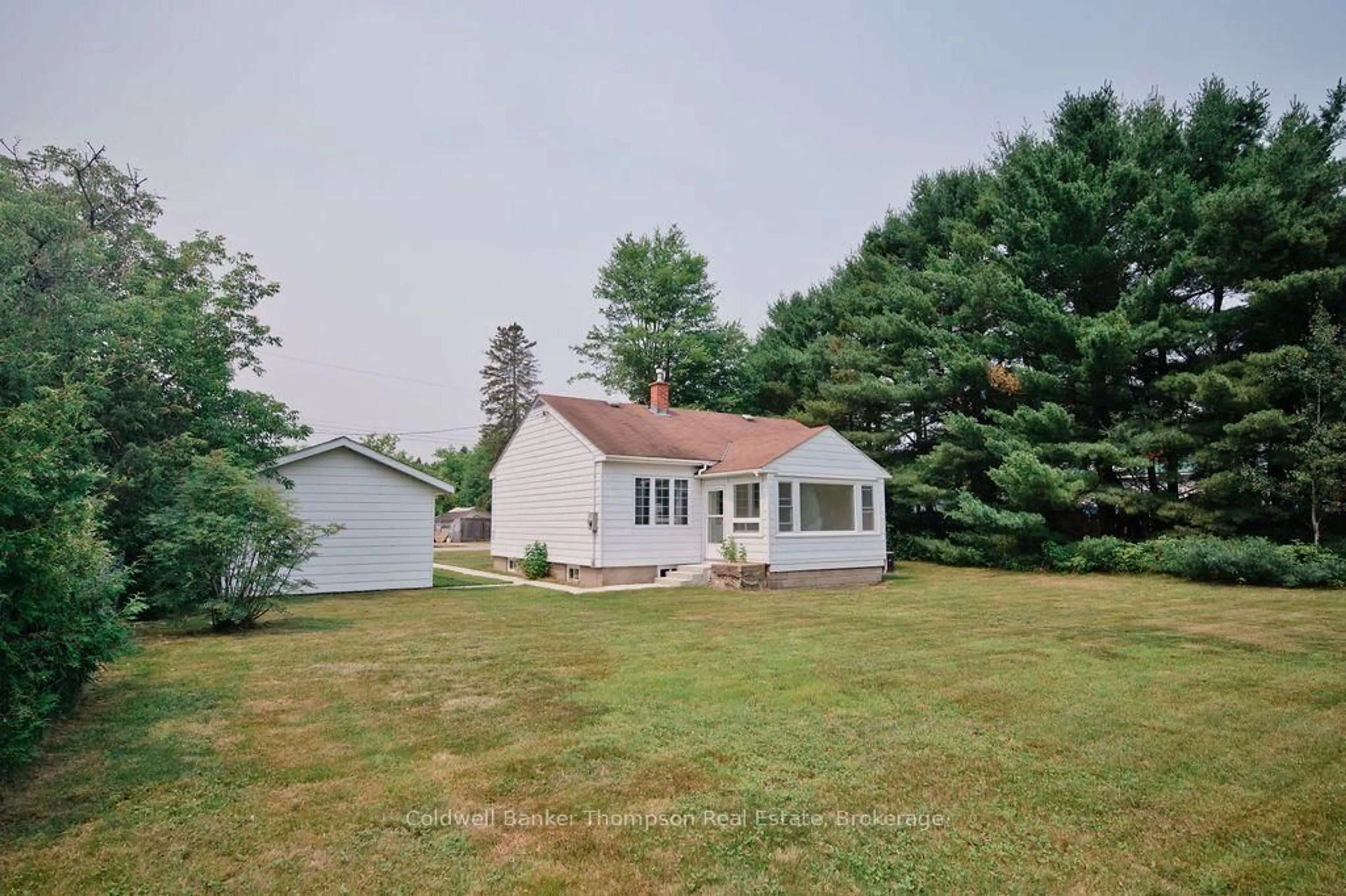 A pic from outside/outdoor area/front of a property/back of a property/a pic from drone, unknown for 12 Connolly St, South River Ontario P0A 1X0