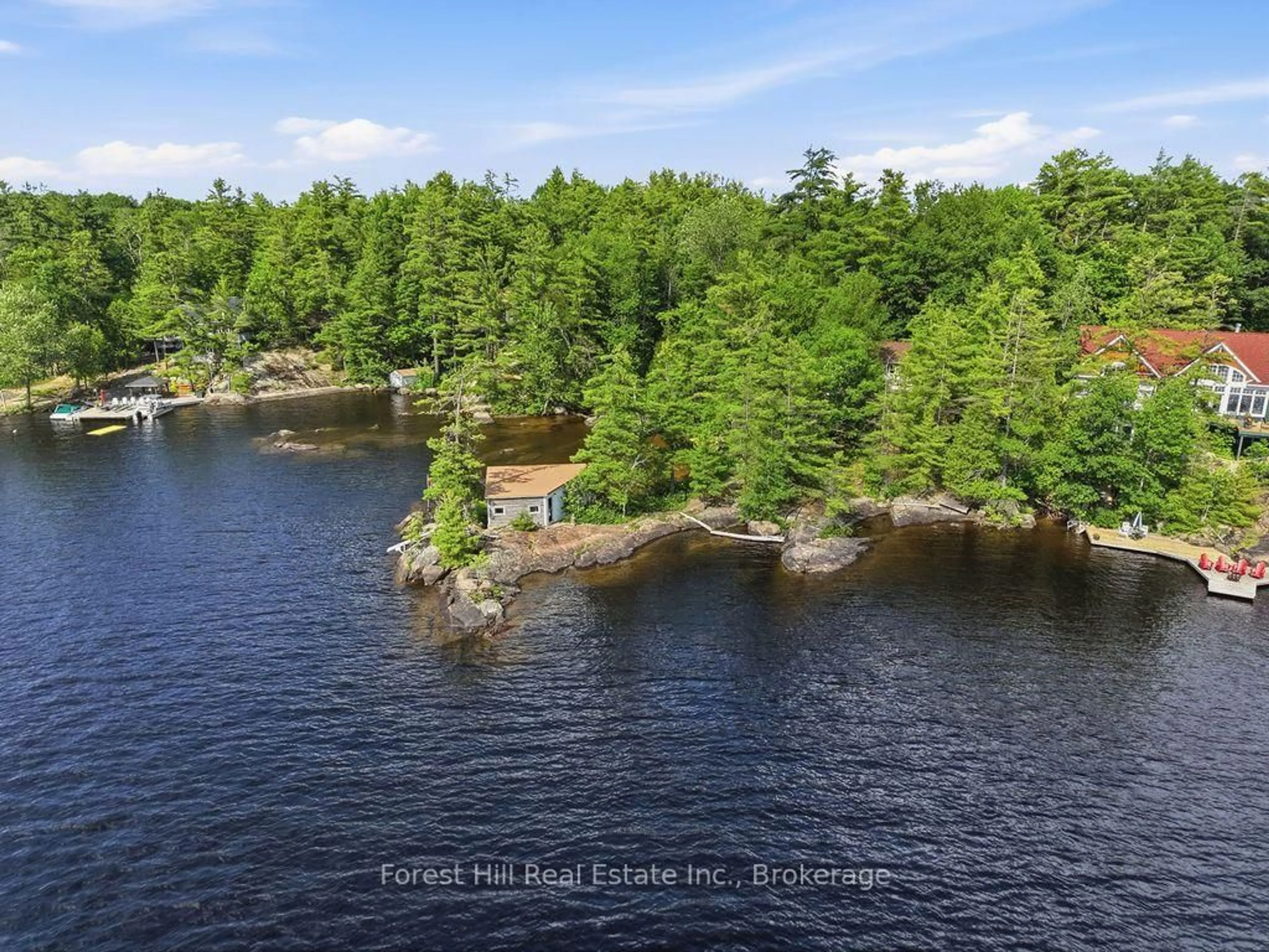 A pic from outside/outdoor area/front of a property/back of a property/a pic from drone, water/lake/river/ocean view for 1211 Waldmere Rd, Bracebridge Ontario P1L 1W8