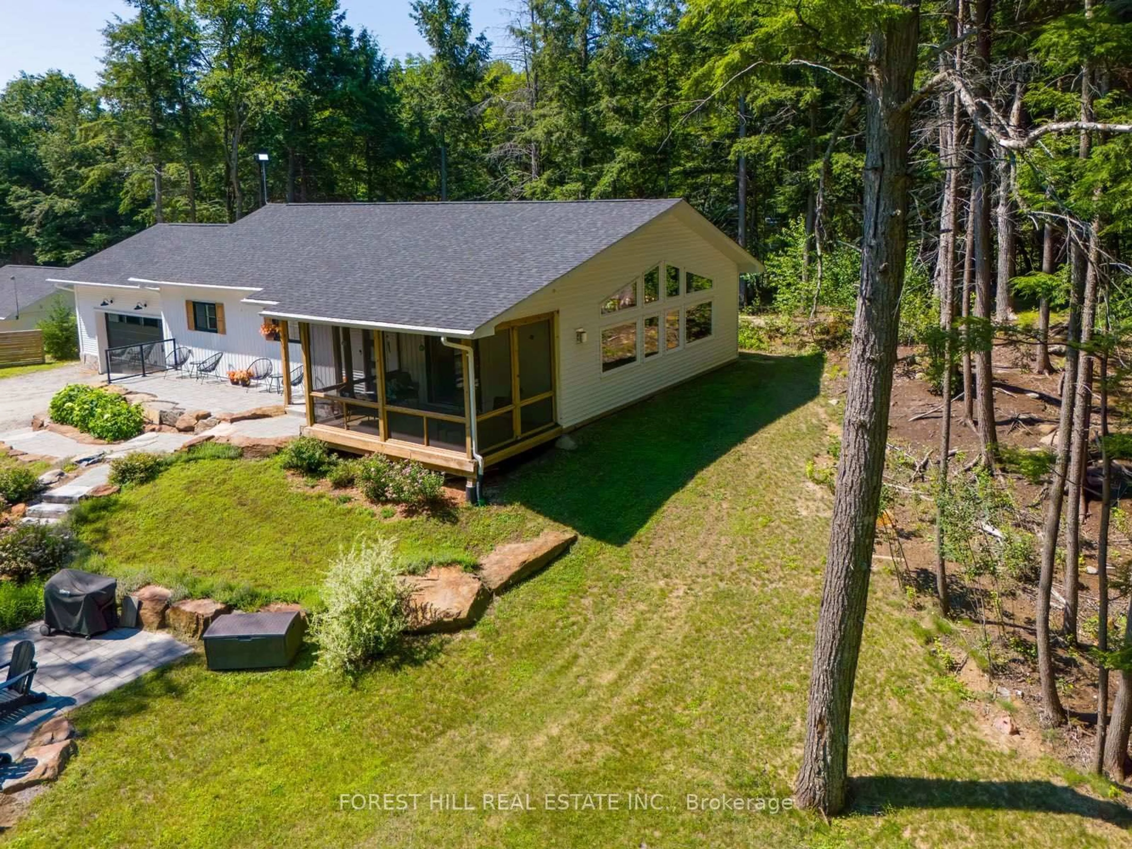 A pic from outside/outdoor area/front of a property/back of a property/a pic from drone, water/lake/river/ocean view for 315 North Fox Lake Rd, Huntsville Ontario P1H 2J2