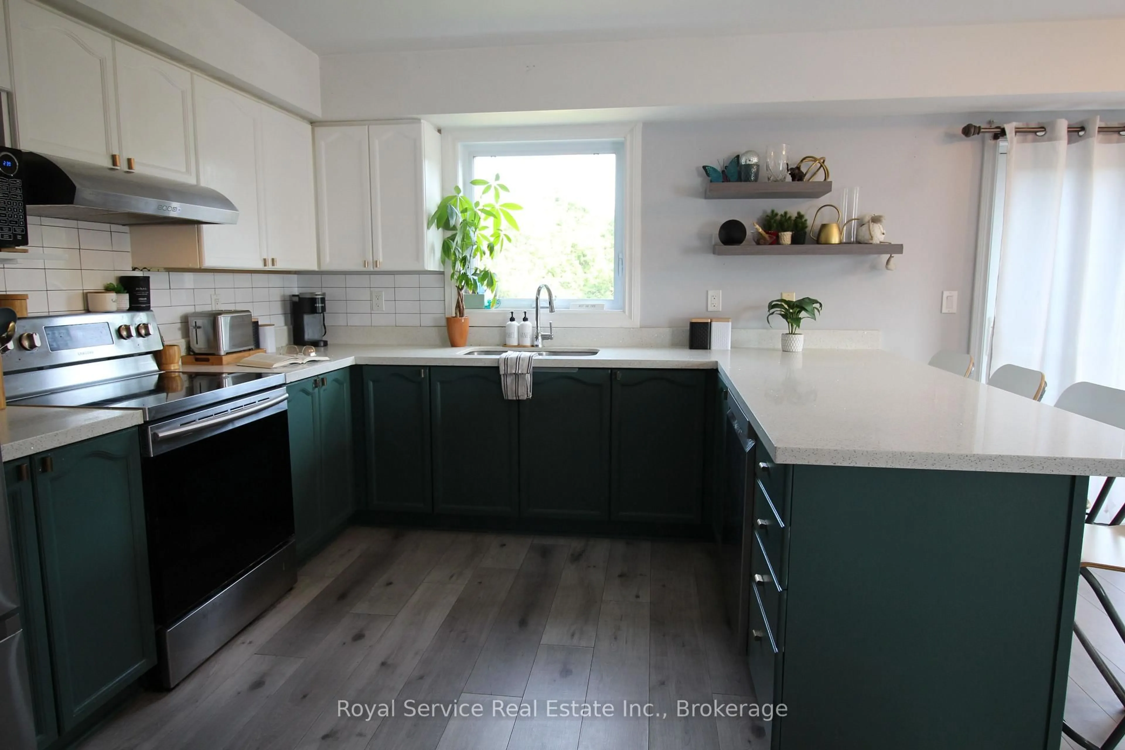 Open concept kitchen, wood/laminate floor for 248 Ruttan Terr, Cobourg Ontario K9A 5X6