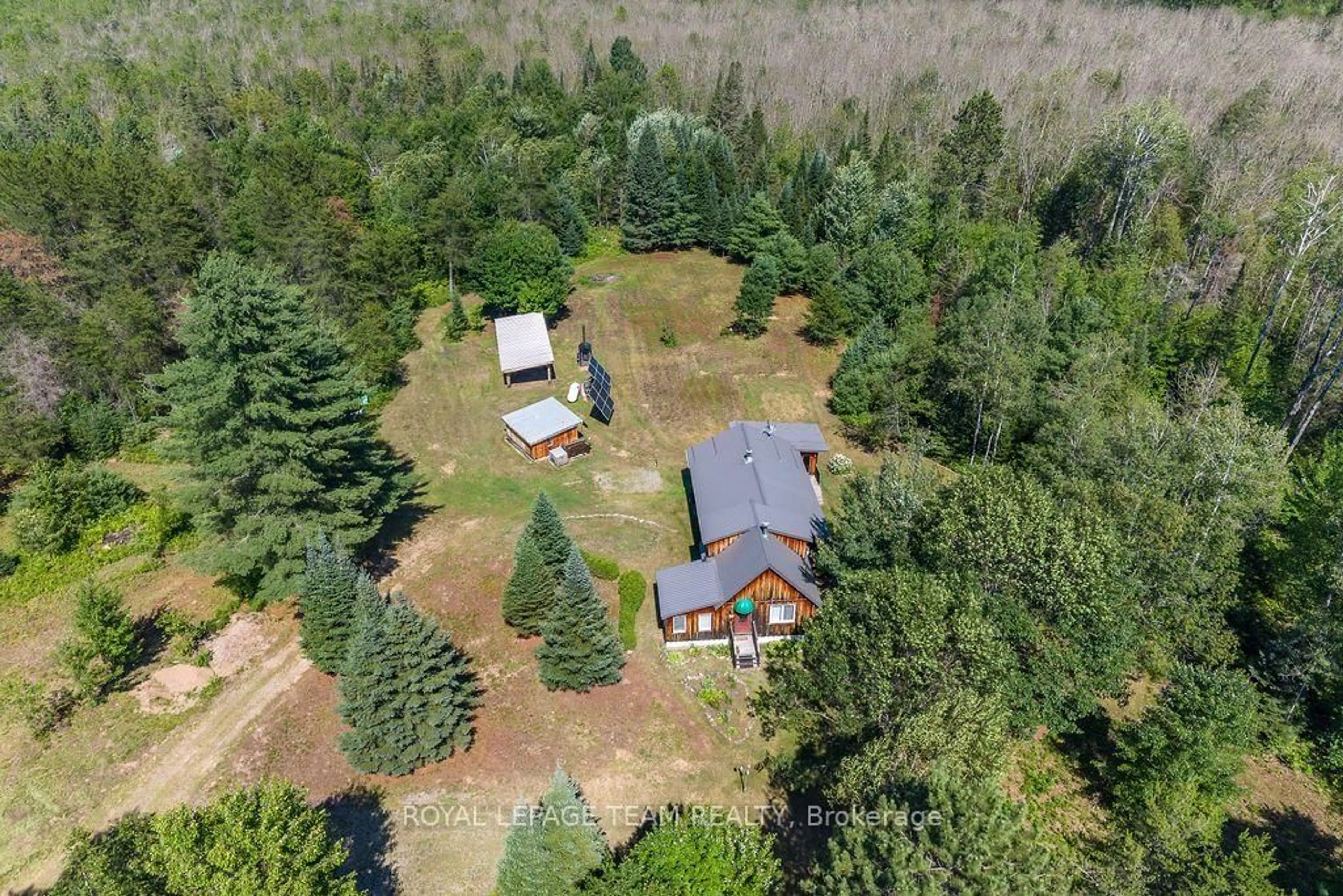 A pic from outside/outdoor area/front of a property/back of a property/a pic from drone, forest/trees view for 1790 Simpson Pit Rd, Round Lake Centre Ontario K0J 2J0