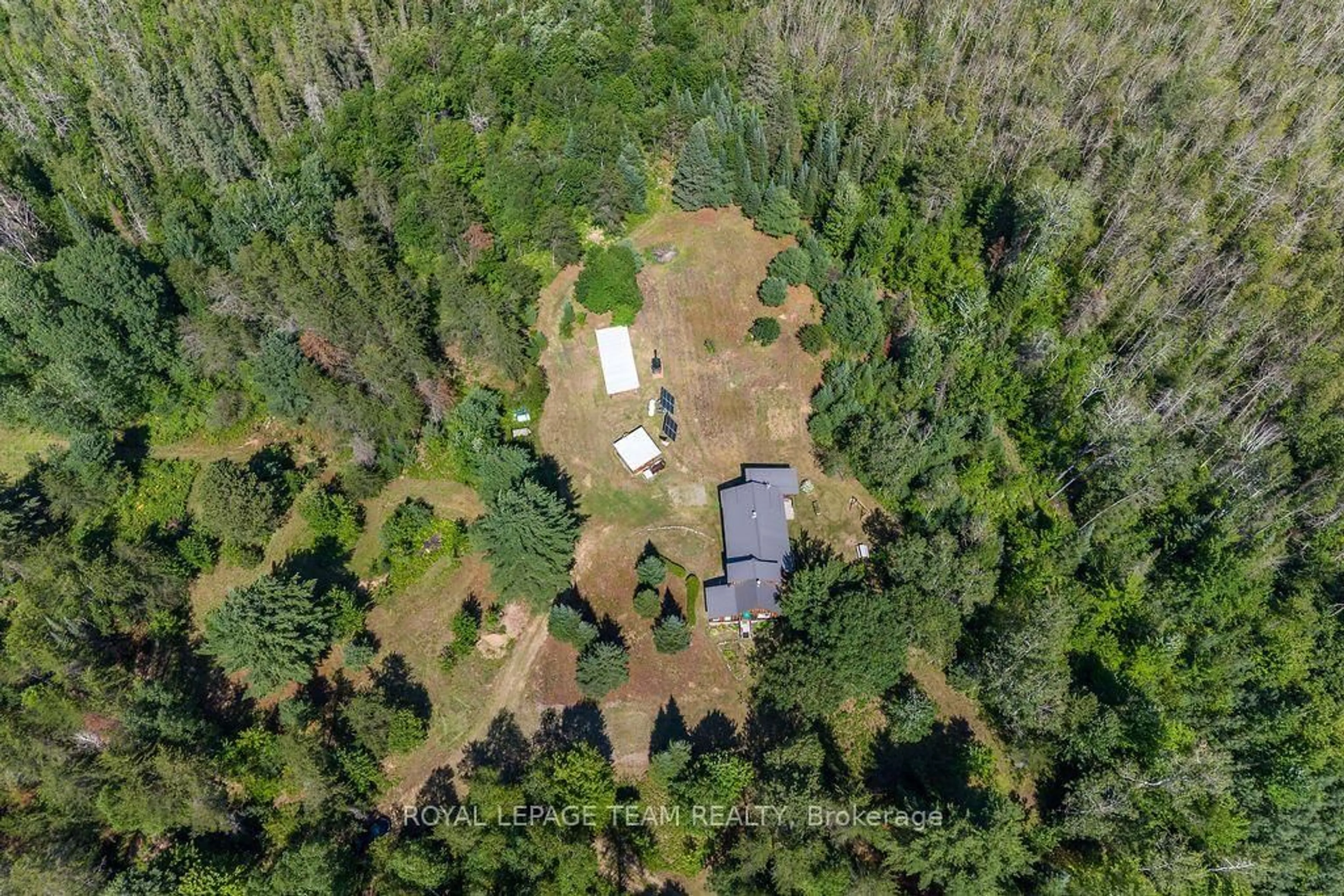 A pic from outside/outdoor area/front of a property/back of a property/a pic from drone, forest/trees view for 1790 Simpson Pit Rd, Round Lake Centre Ontario K0J 2J0