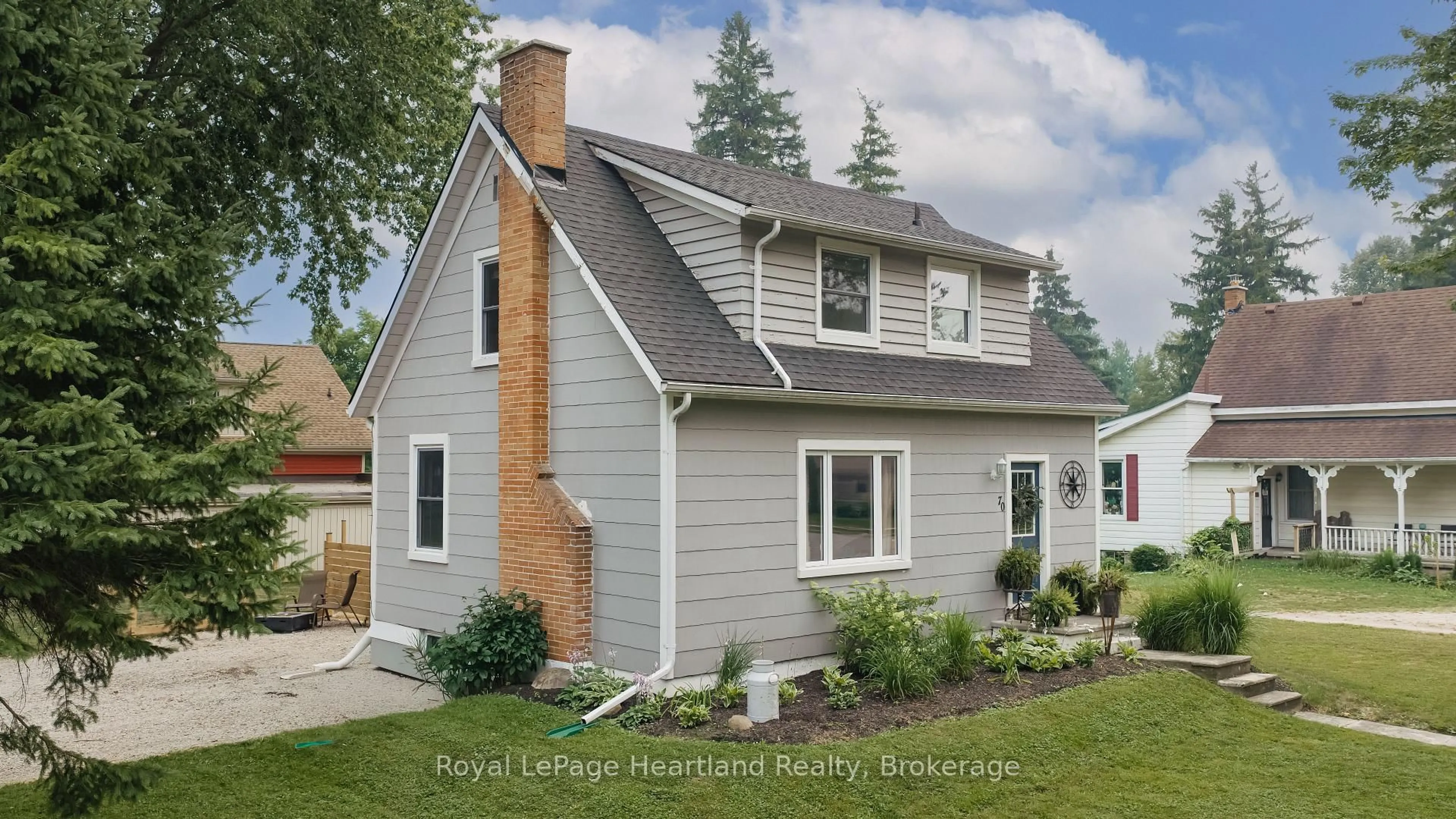Home with vinyl exterior material, street for 70 Main St, Huron East Ontario N0K 1W0