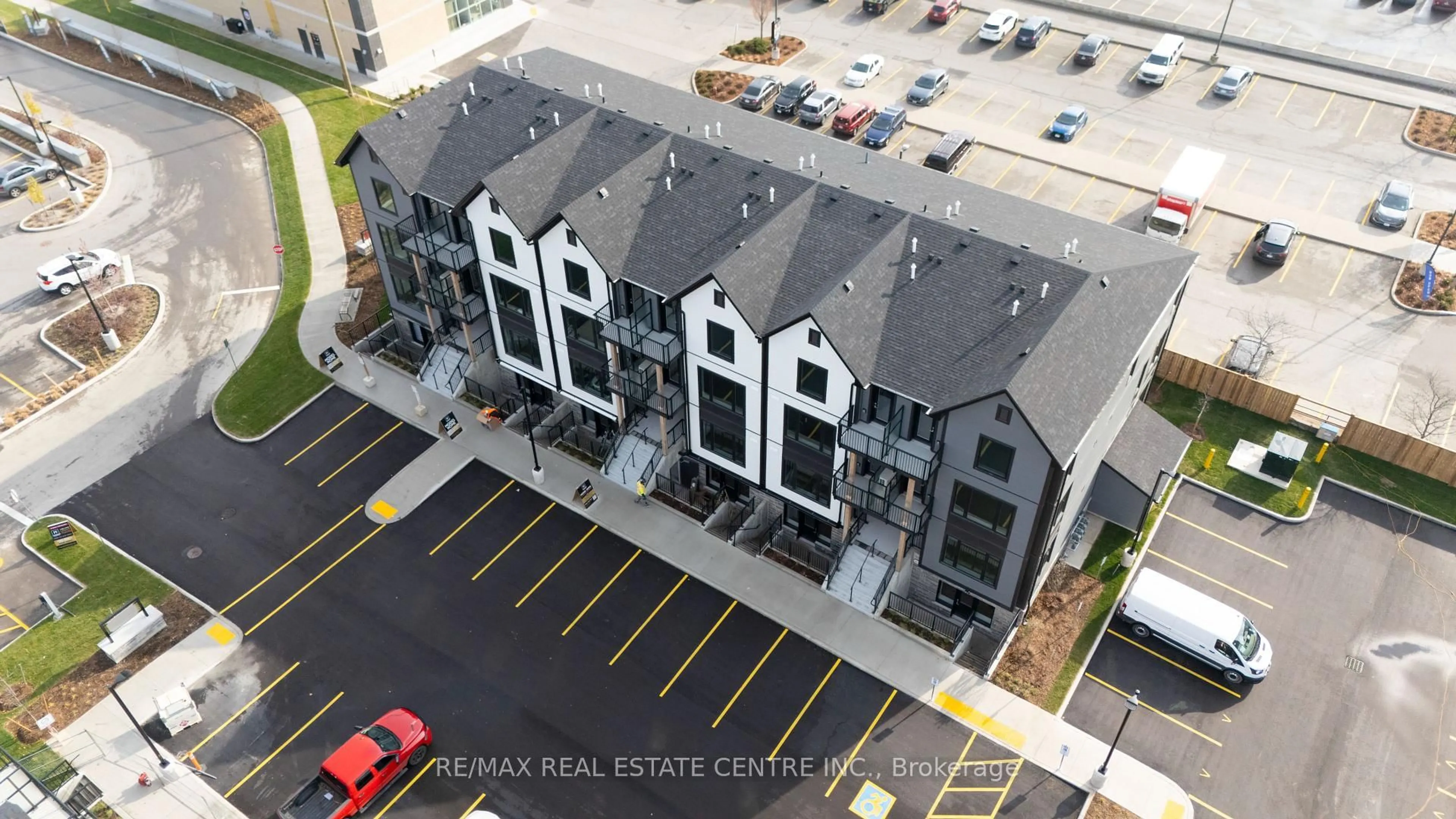 A pic from outside/outdoor area/front of a property/back of a property/a pic from drone, unknown for 708 Woolwich St #117, Guelph Ontario N1H 3Z1