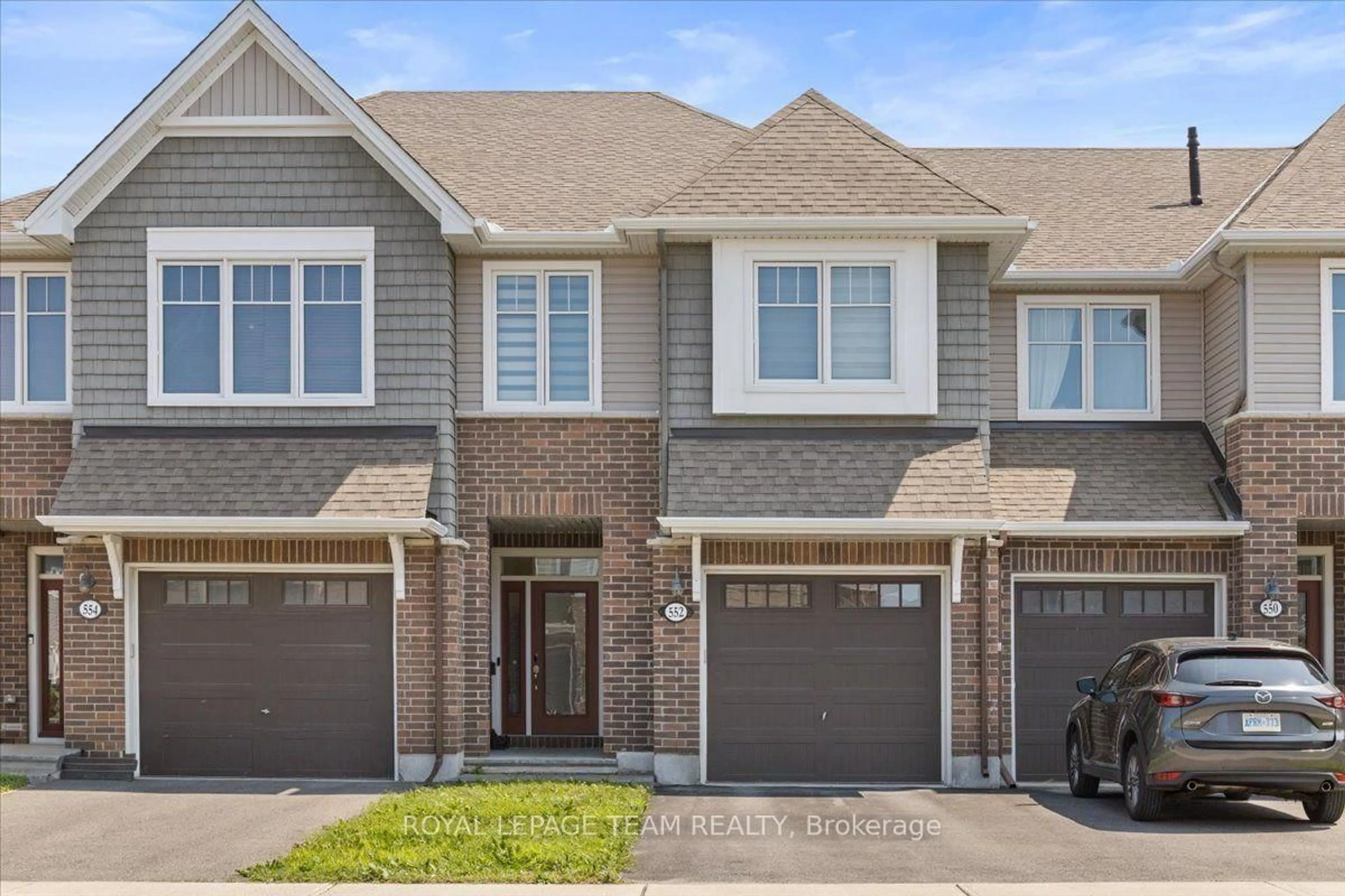 Home with brick exterior material, street for 552 Jackdaw Ave, Ottawa Ontario K2J 6N1