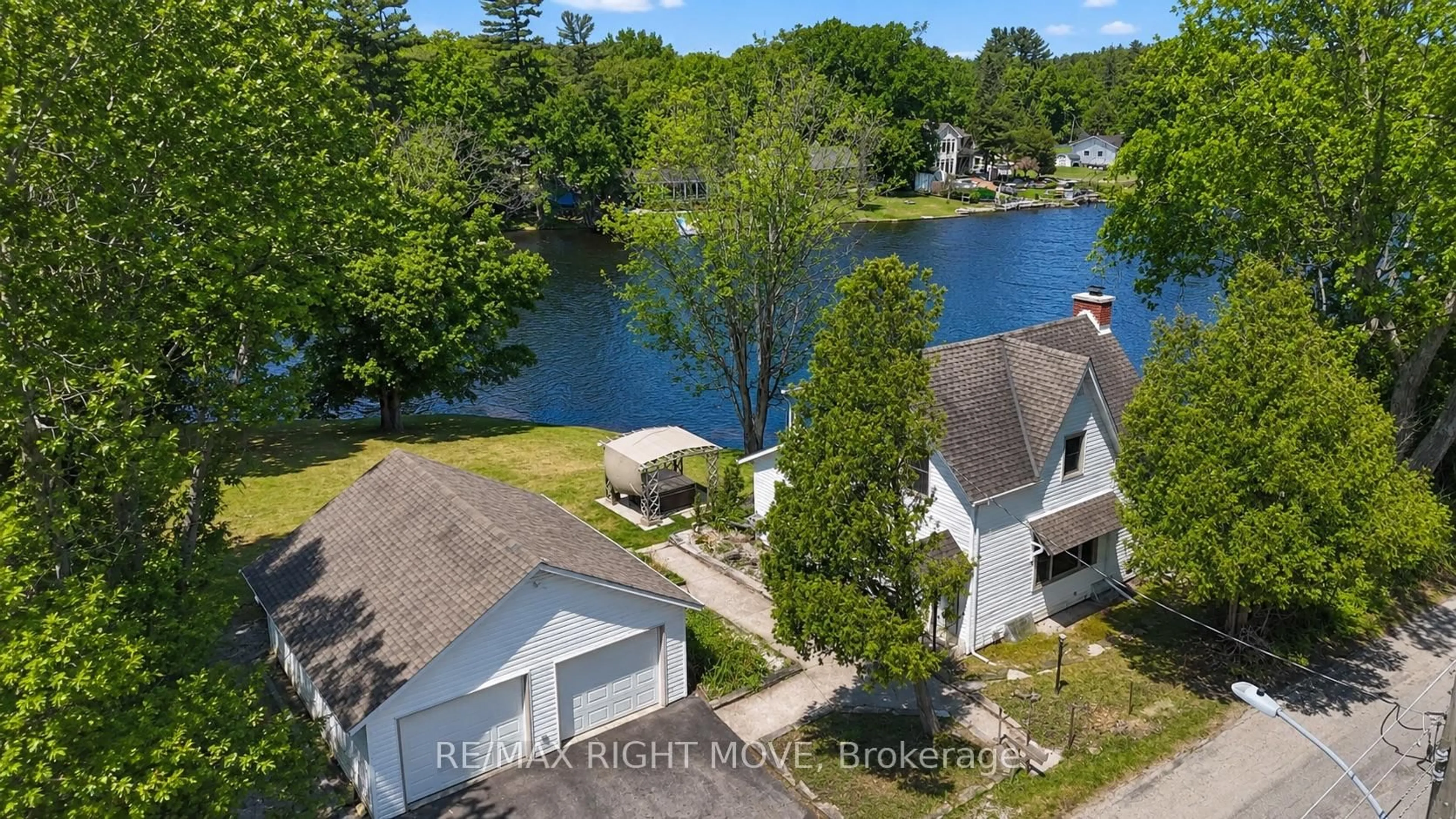 A pic from outside/outdoor area/front of a property/back of a property/a pic from drone, water/lake/river/ocean view for 1012 Cowbell Lane, Gravenhurst Ontario P0E 1N0