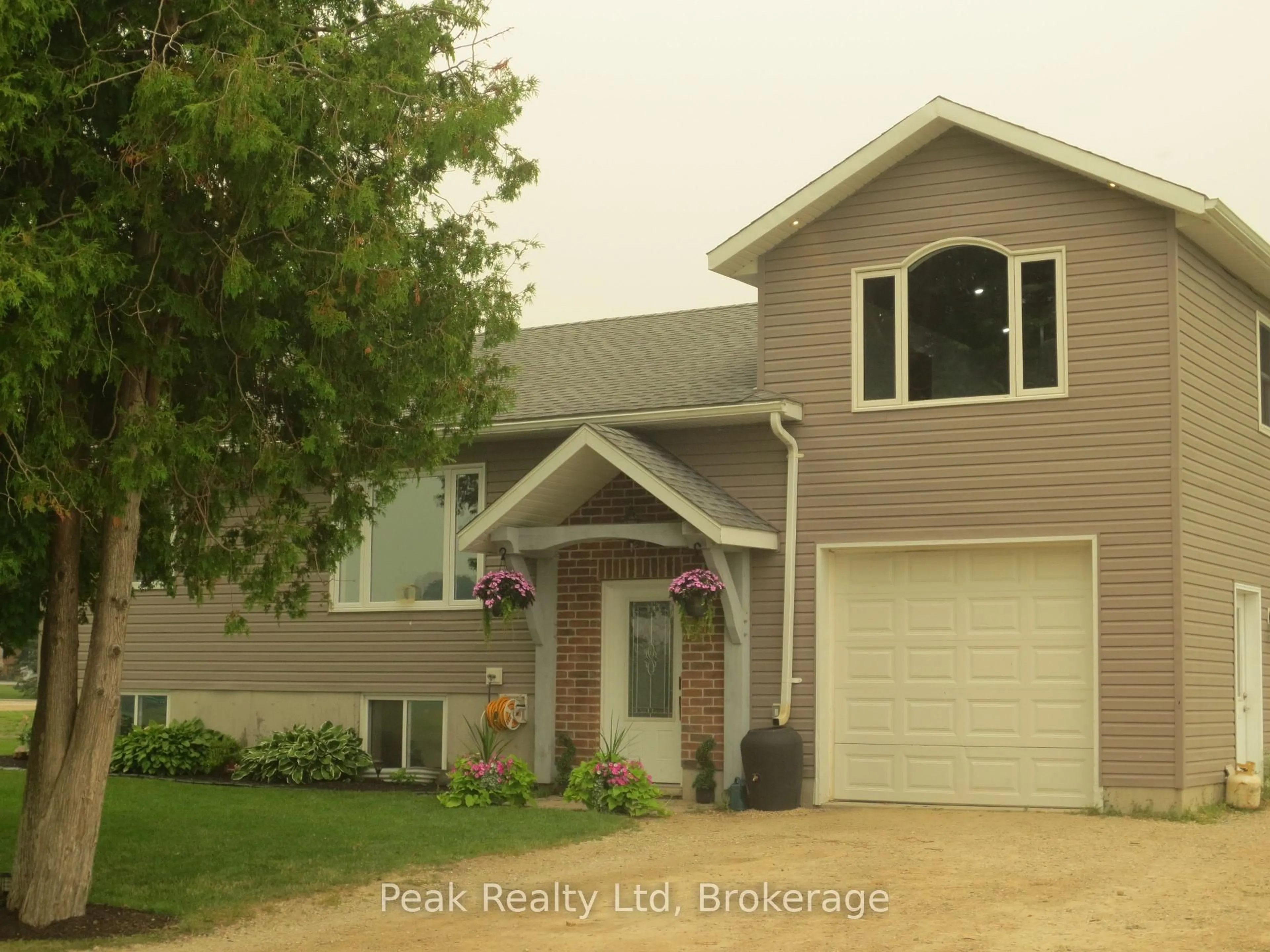 Home with vinyl exterior material, street for 5773 Highway 23 Highway, Minto Ontario N0G 1Z0