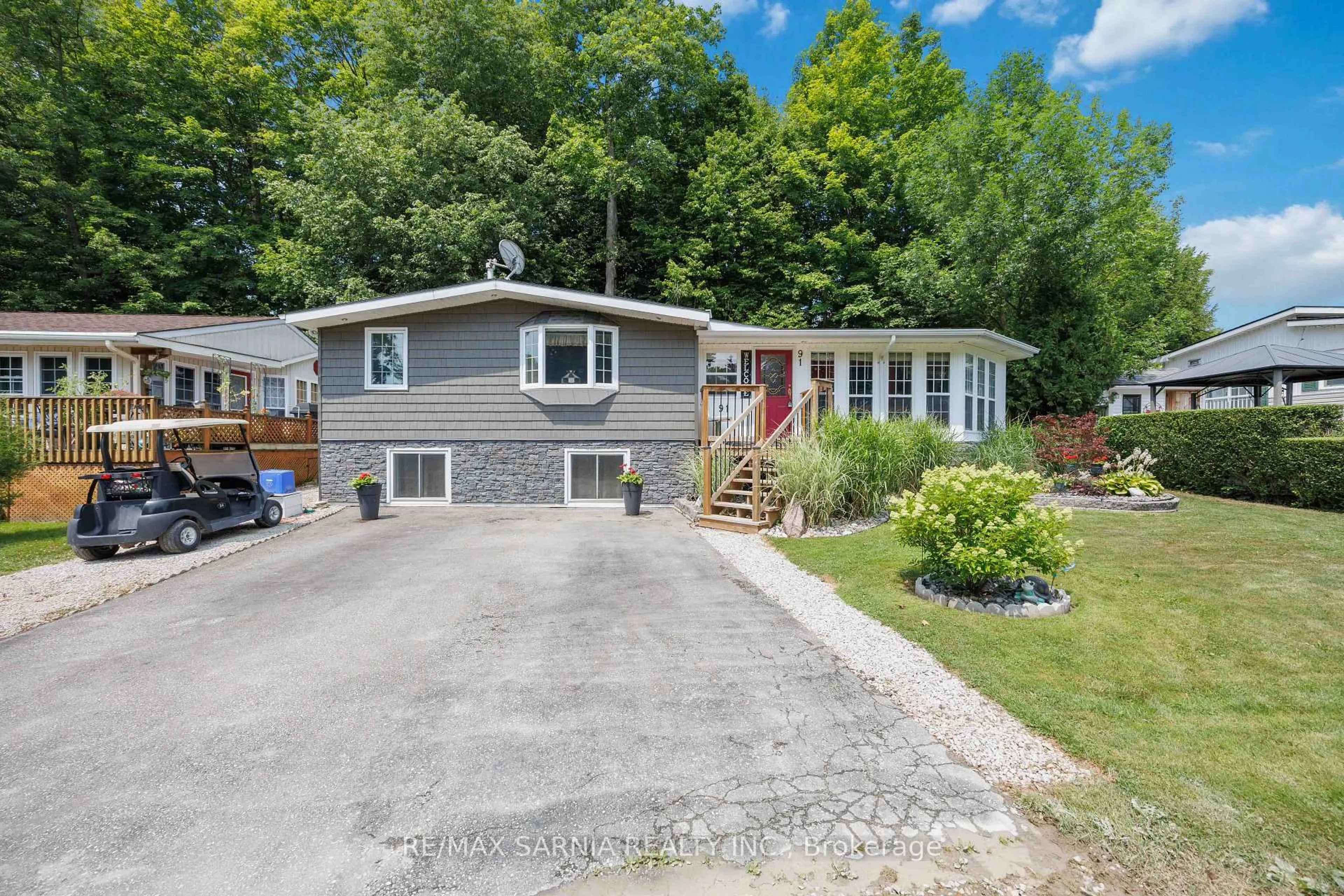 A pic from outside/outdoor area/front of a property/back of a property/a pic from drone, street for 4895 Lakeshore Rd #A91, Plympton-Wyoming Ontario N0N 1J6