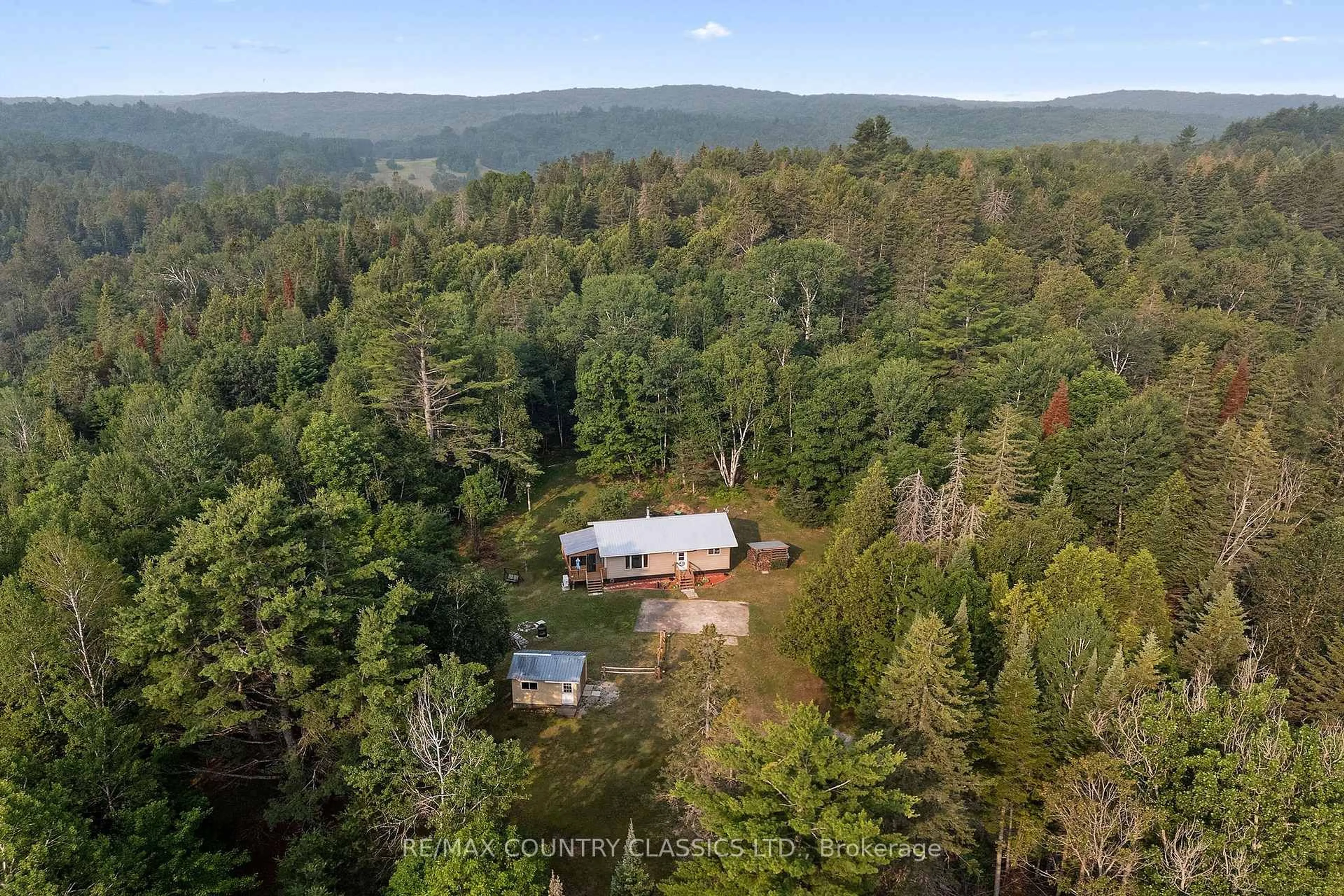A pic from outside/outdoor area/front of a property/back of a property/a pic from drone, forest/trees view for 528 Hwy No.28, Denbigh Ontario K0H 1L0