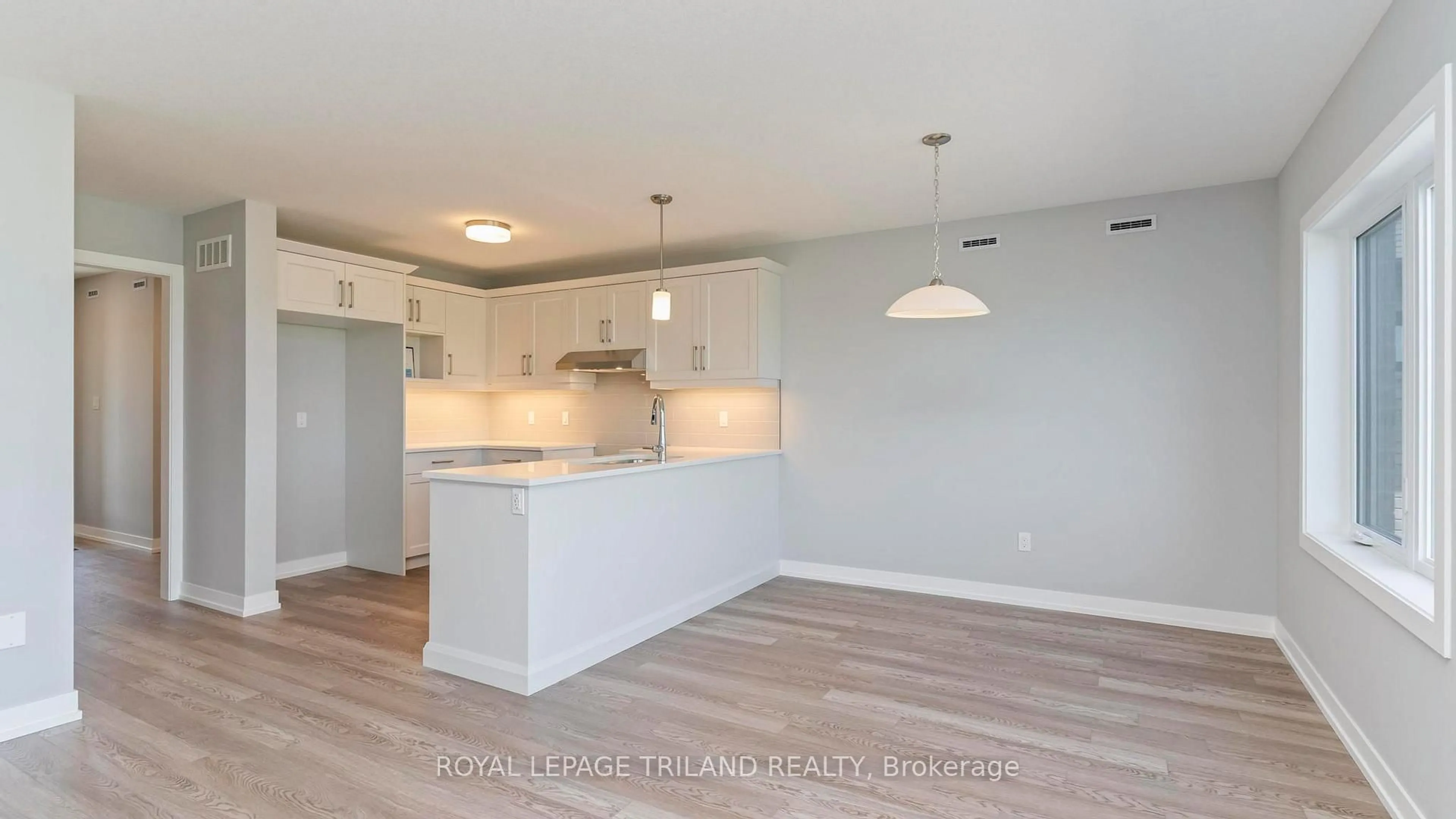 Open concept kitchen, wood/laminate floor for 45 HARROW Lane, St. Thomas Ontario N5R 0P3