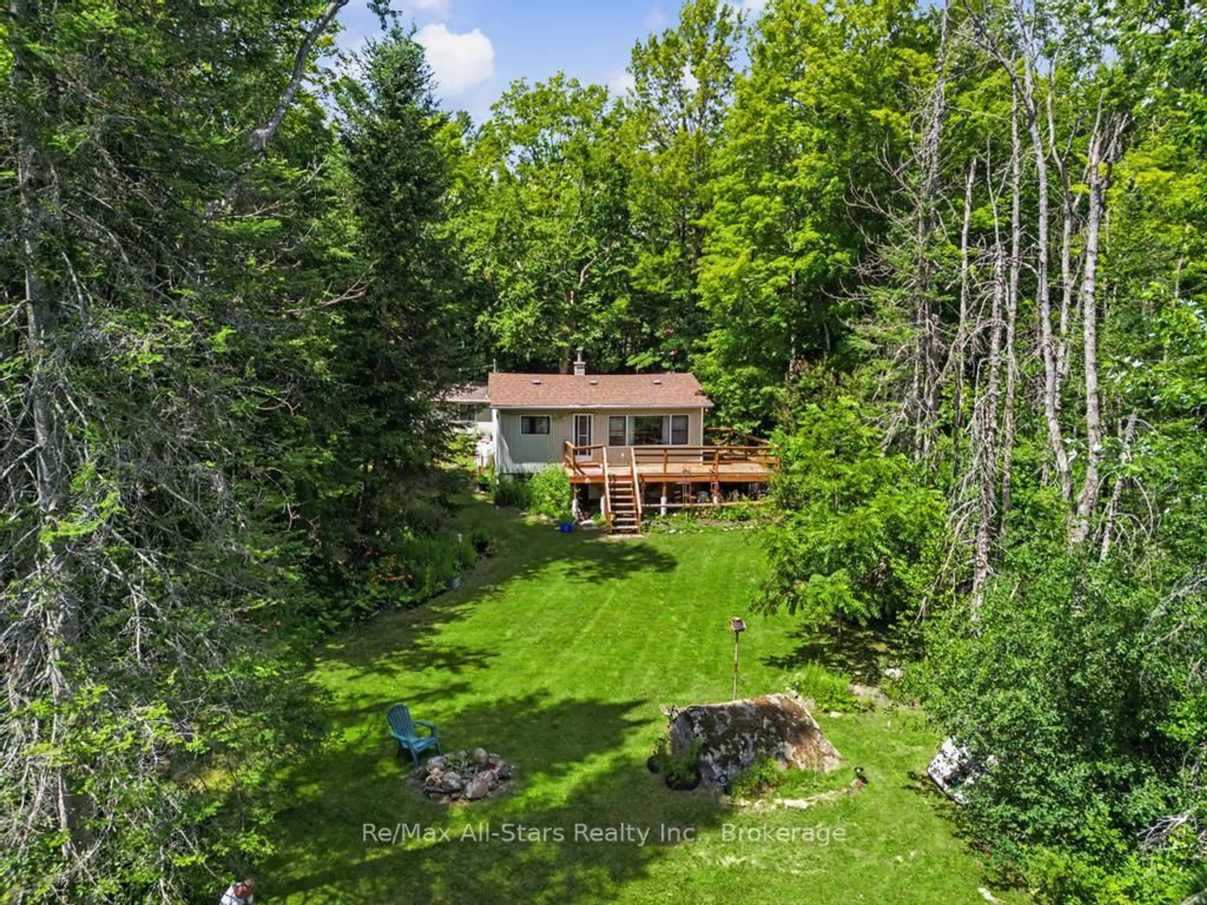 A pic from outside/outdoor area/front of a property/back of a property/a pic from drone, forest/trees view for 6 Kennedy Crt, Trent Lakes Ontario K0M 1A0