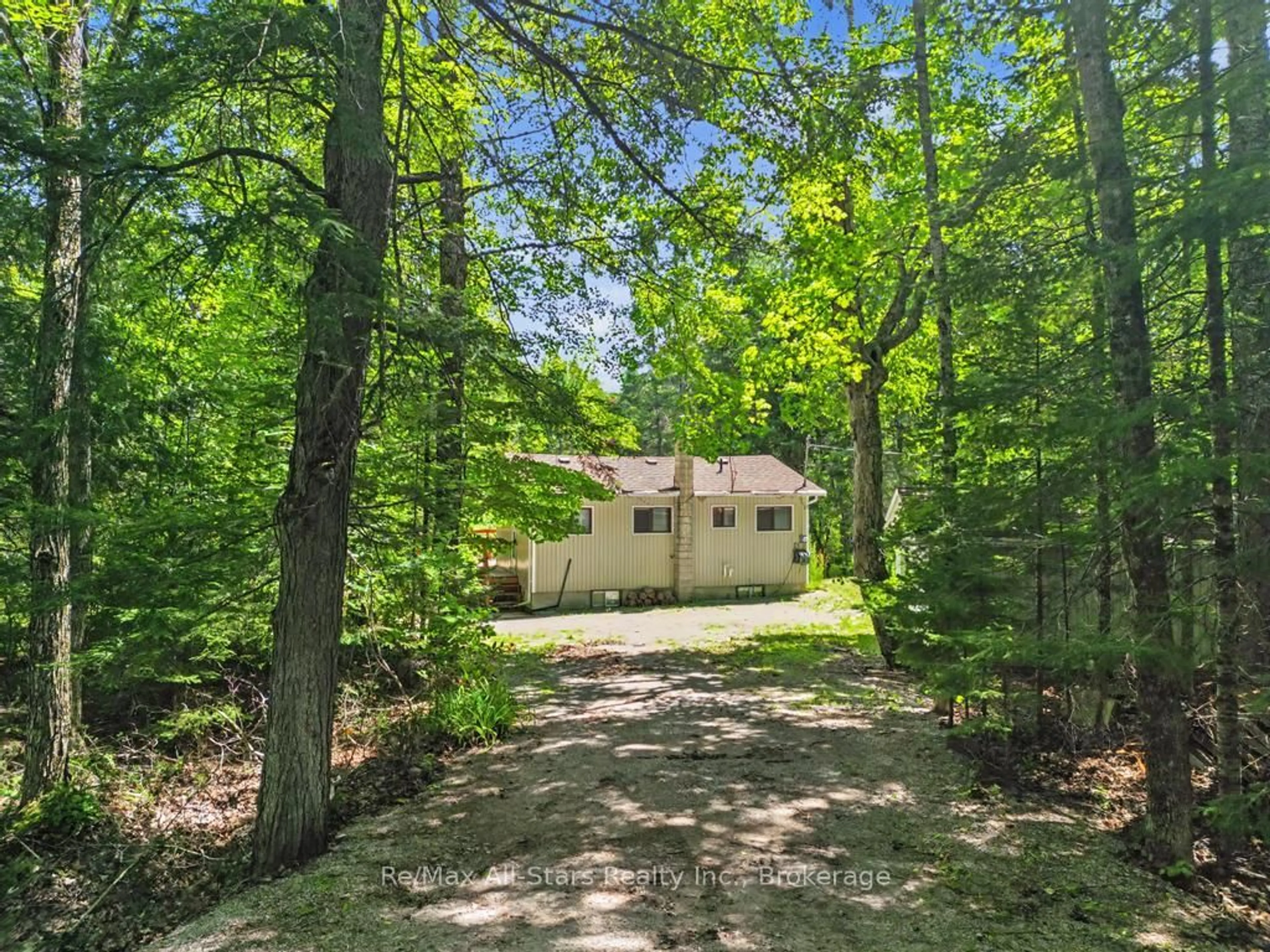 A pic from outside/outdoor area/front of a property/back of a property/a pic from drone, forest/trees view for 6 Kennedy Crt, Trent Lakes Ontario K0M 1A0