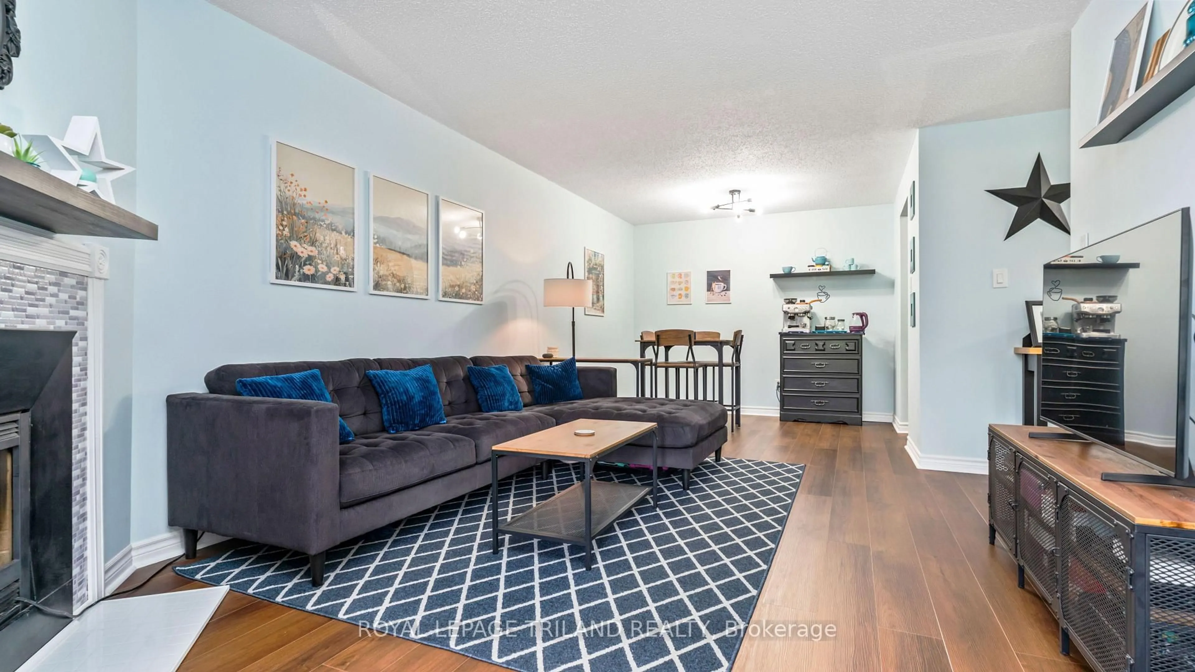 Living room with furniture, wood/laminate floor for 735 DEVERON Cres #116, London South Ontario N5Z 4X8