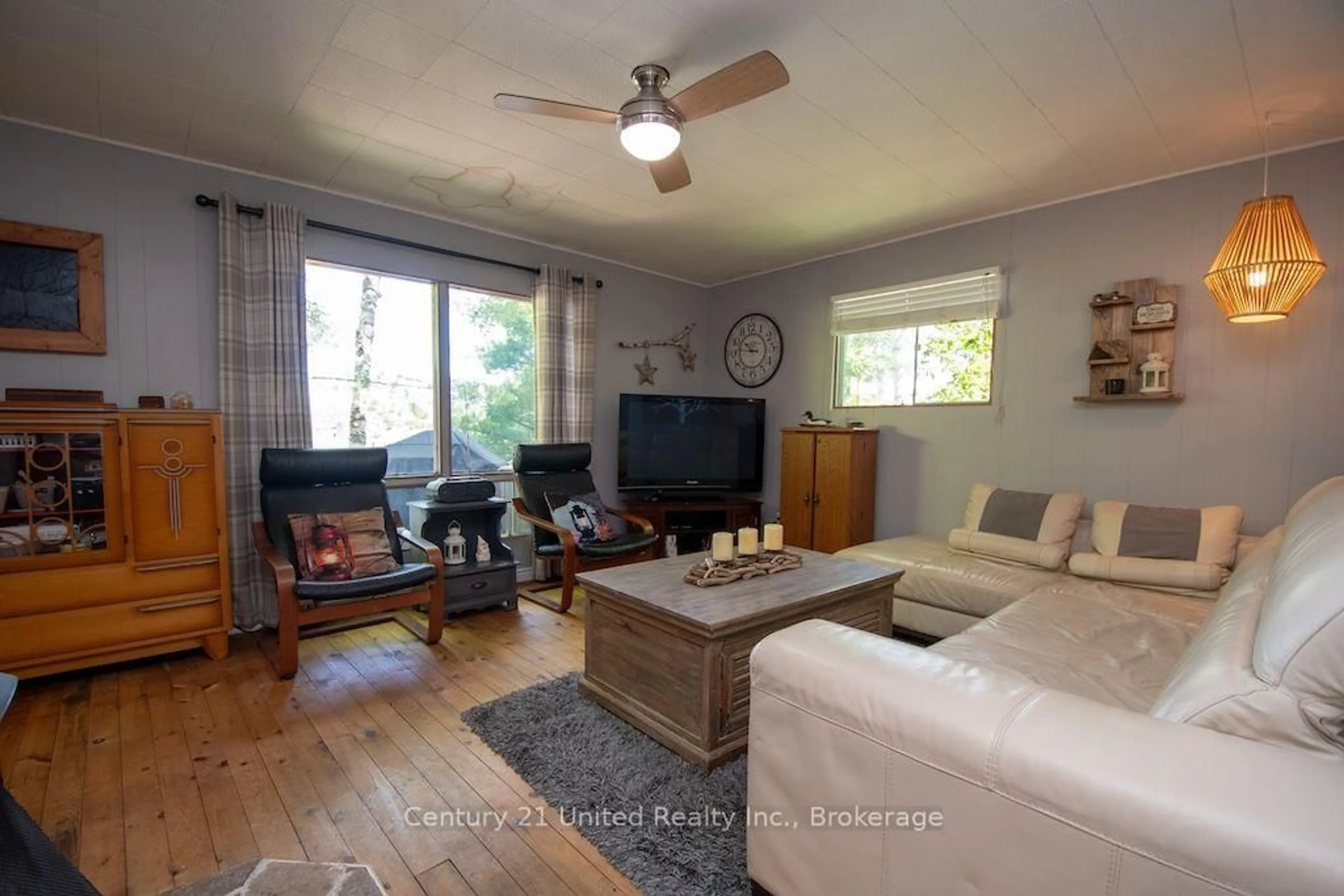 Living room with furniture, wood/laminate floor for 174 Fire Route 55, North Kawartha Ontario K0L 1A0