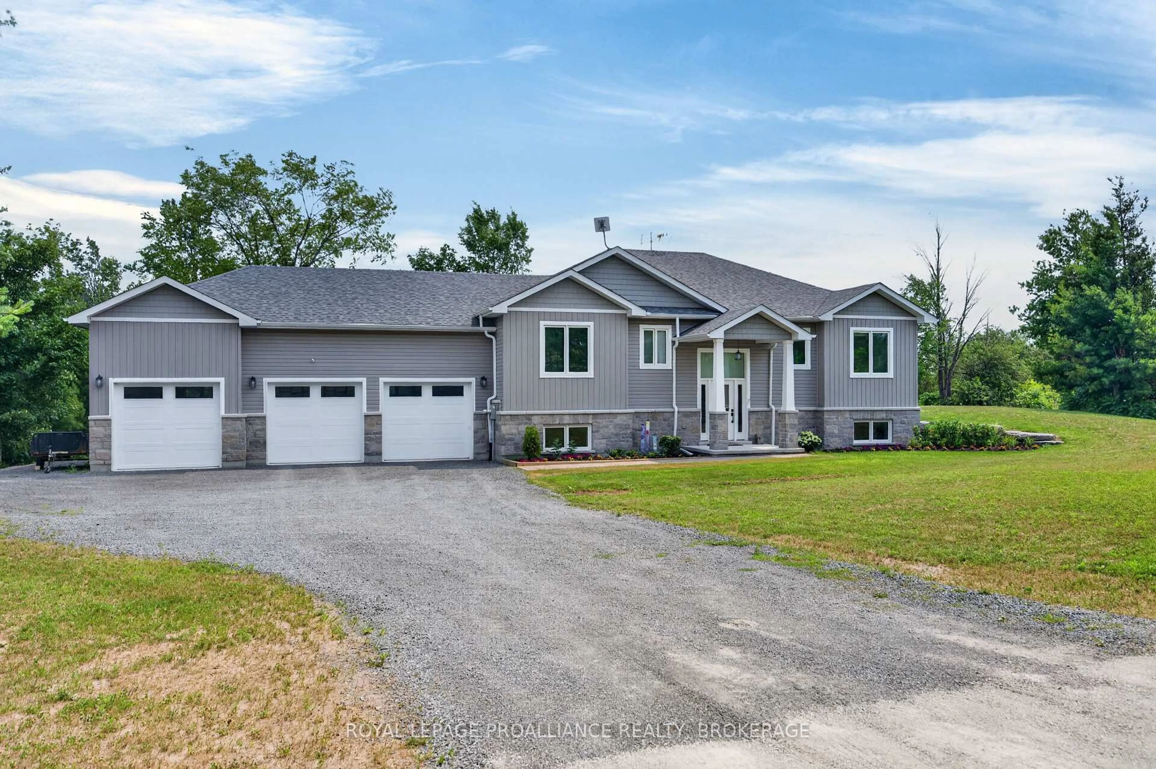 Home with vinyl exterior material, street for 12 Petworth Rd, Yarker Ontario K0K 3N0