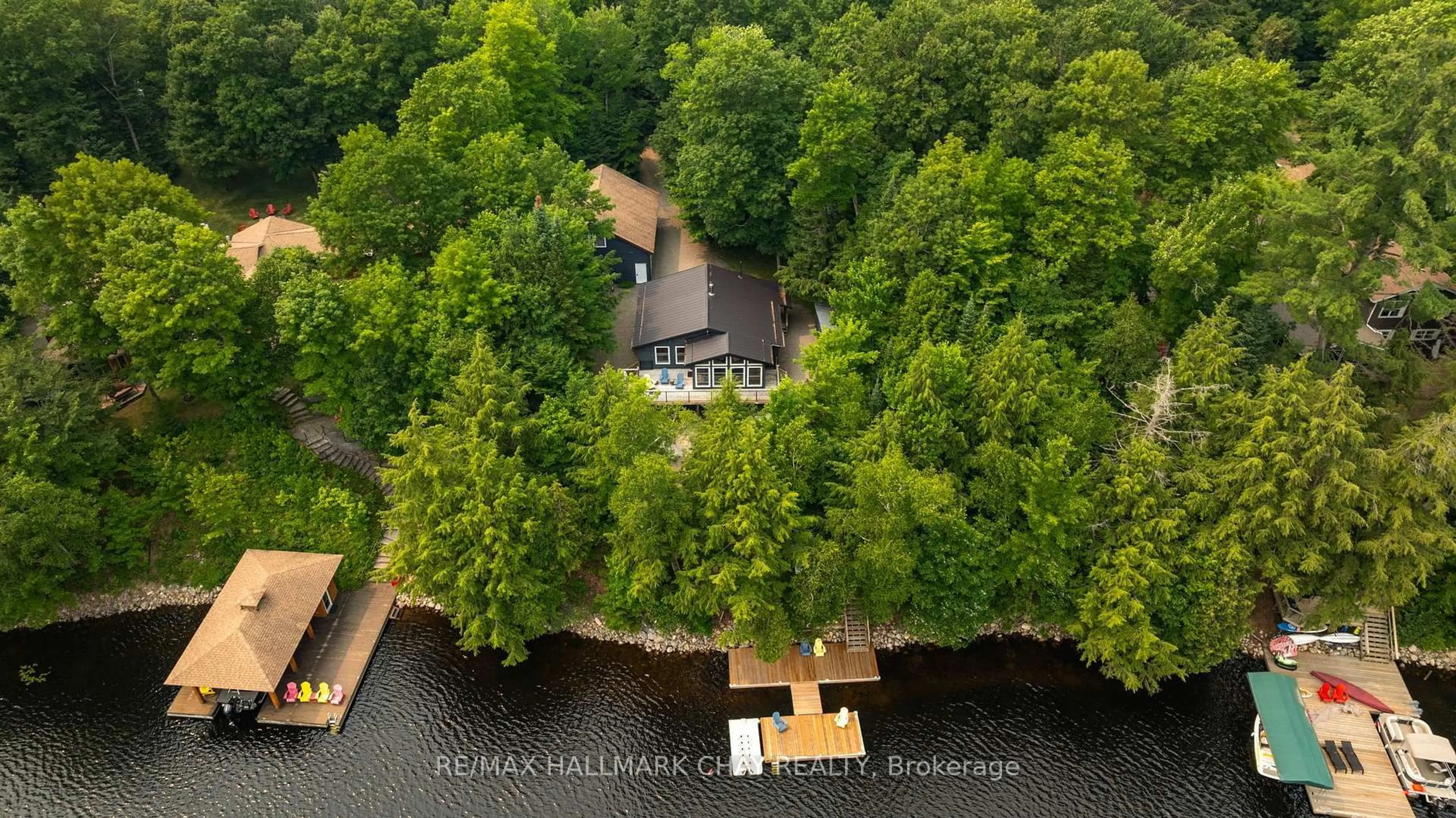 A pic from outside/outdoor area/front of a property/back of a property/a pic from drone, water/lake/river/ocean view for 1315 Wolf Circ, Algonquin Highlands Ontario P0A 1E0