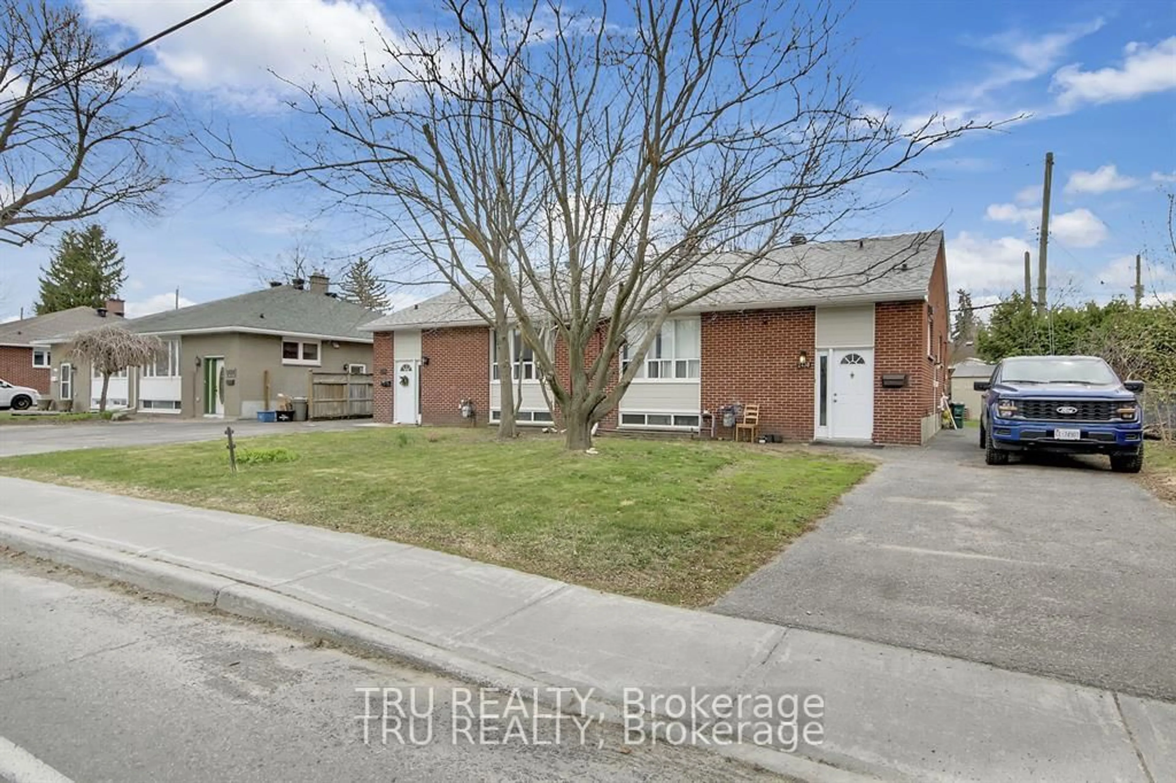 Home with brick exterior material, street for 2428-2430 Iris St, Ottawa Ontario K2C 1C6