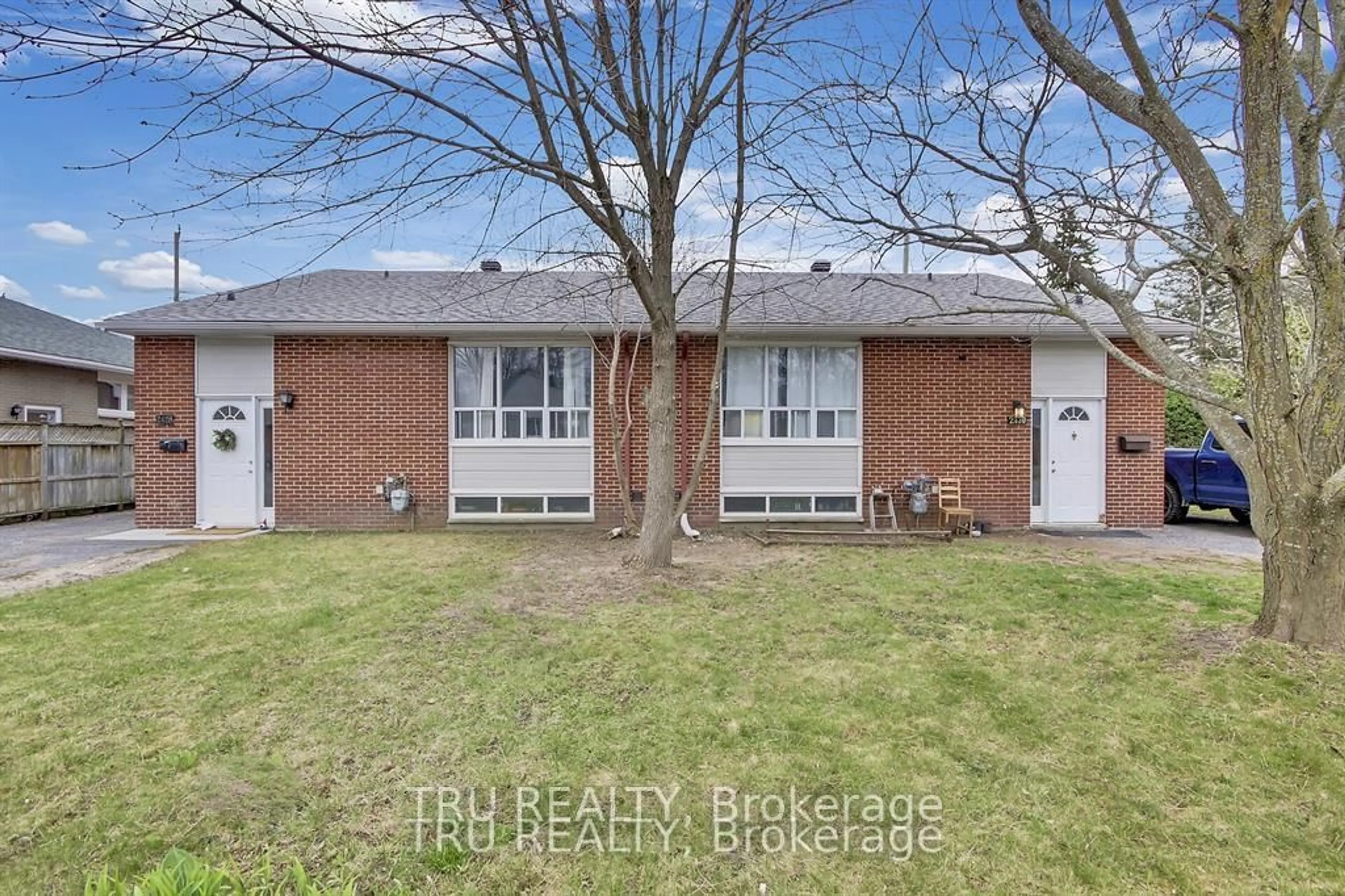 Home with brick exterior material, street for 2428-2430 Iris St, Ottawa Ontario K2C 1C6