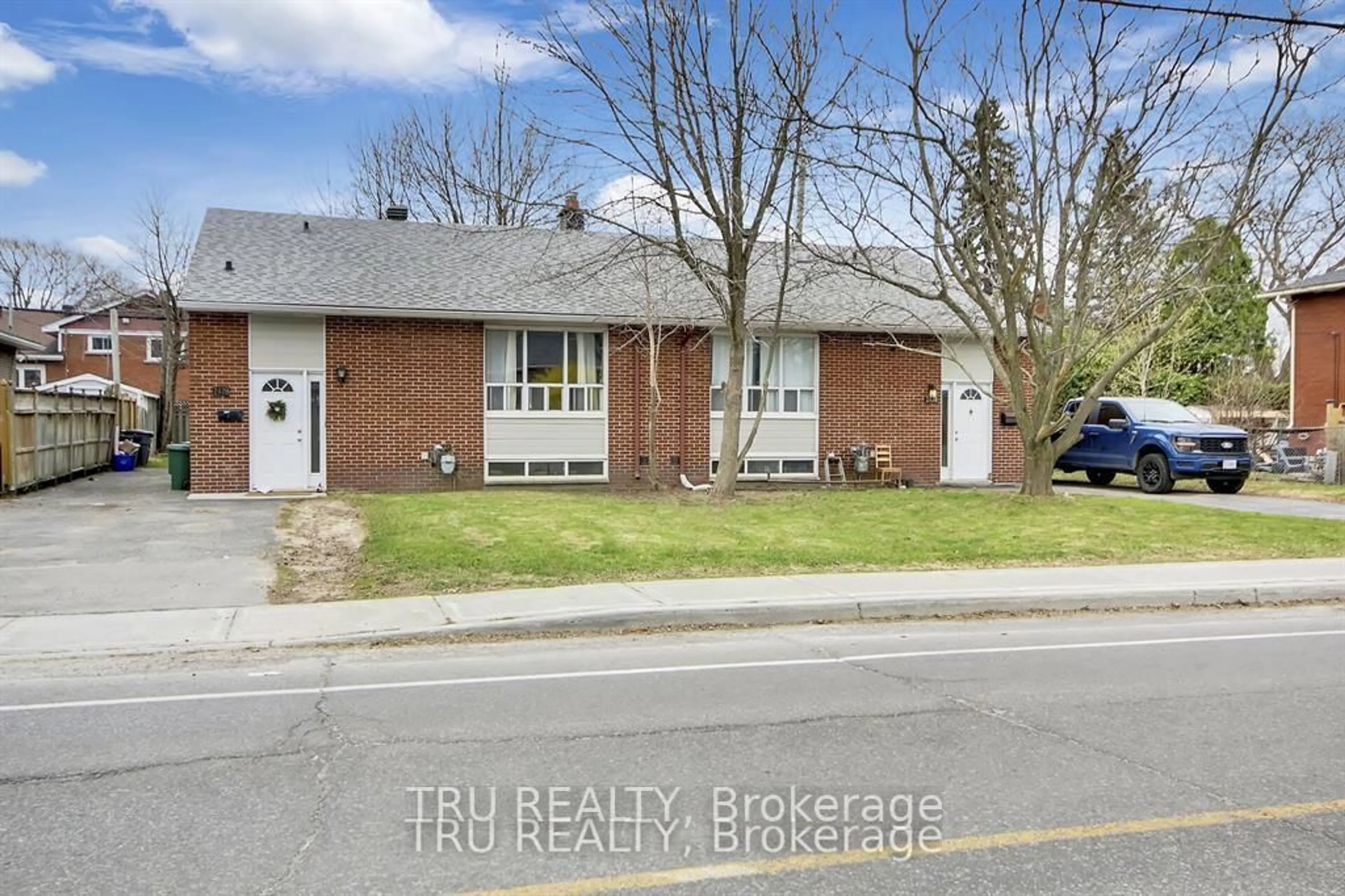Home with brick exterior material, street for 2428-2430 Iris St, Ottawa Ontario K2C 1C6