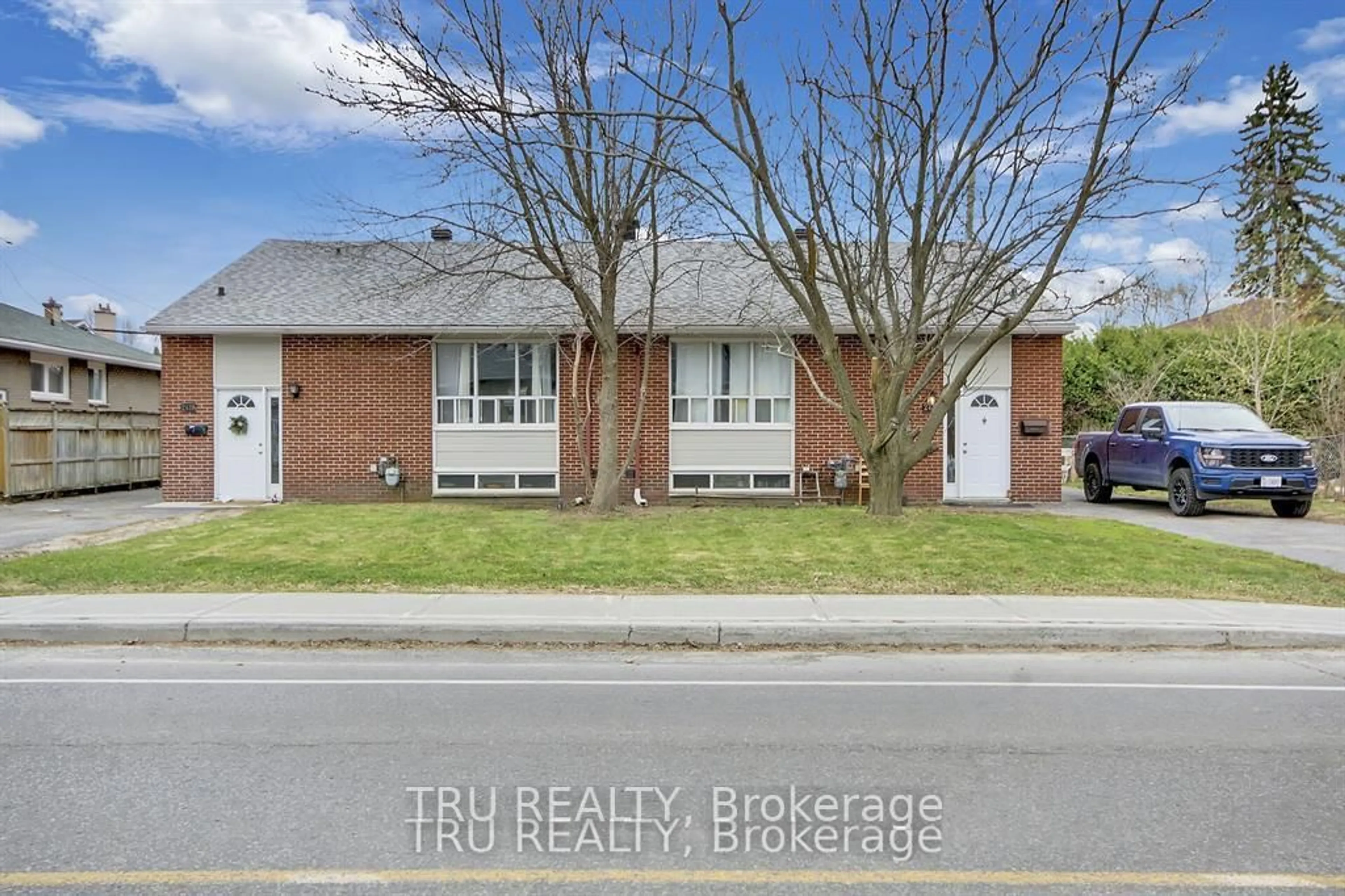 Home with brick exterior material, street for 2428-2430 Iris St, Ottawa Ontario K2C 1C6