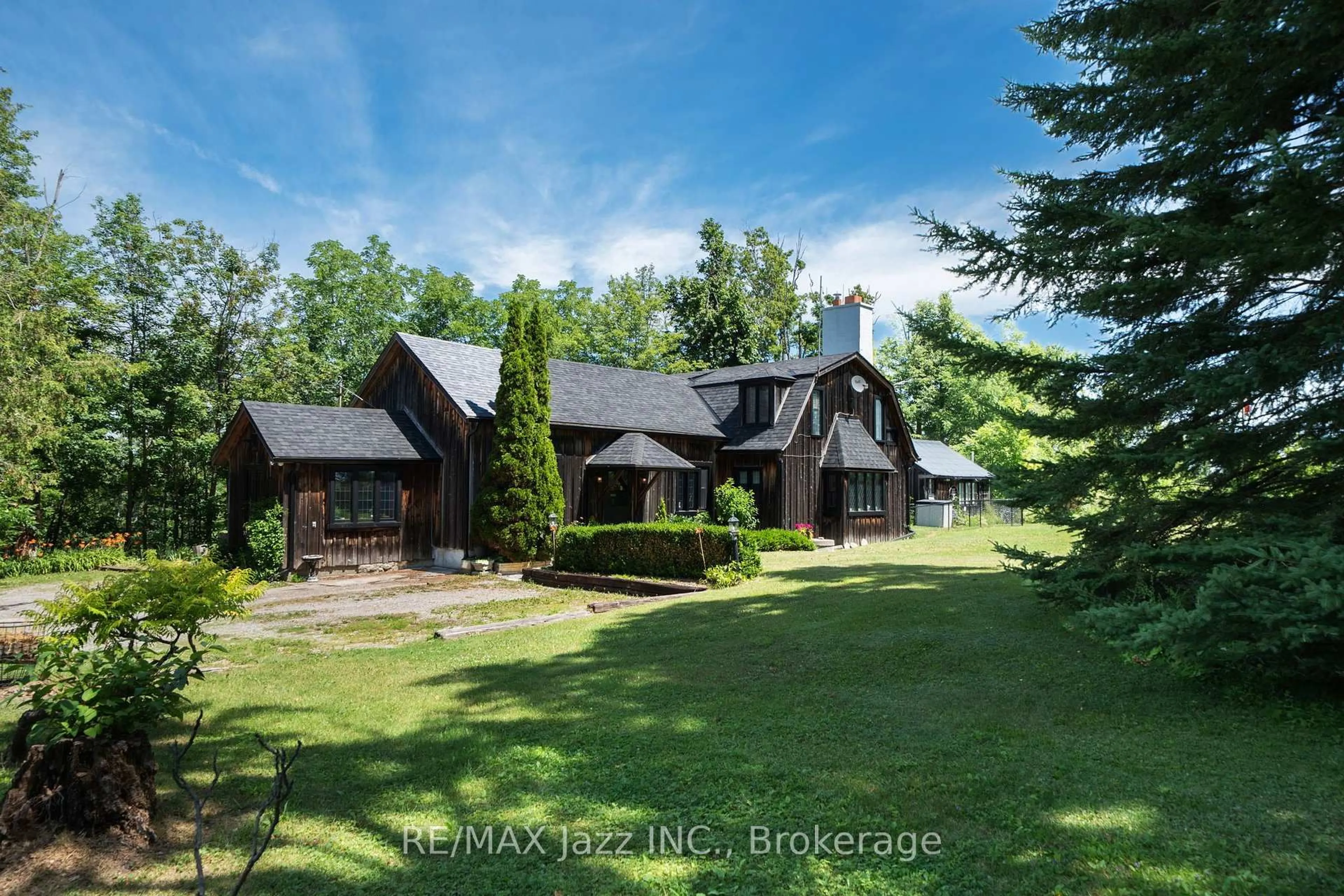 A pic from outside/outdoor area/front of a property/back of a property/a pic from drone, unknown for 372 County Rd 49, Trent Lakes Ontario L0M 1A0