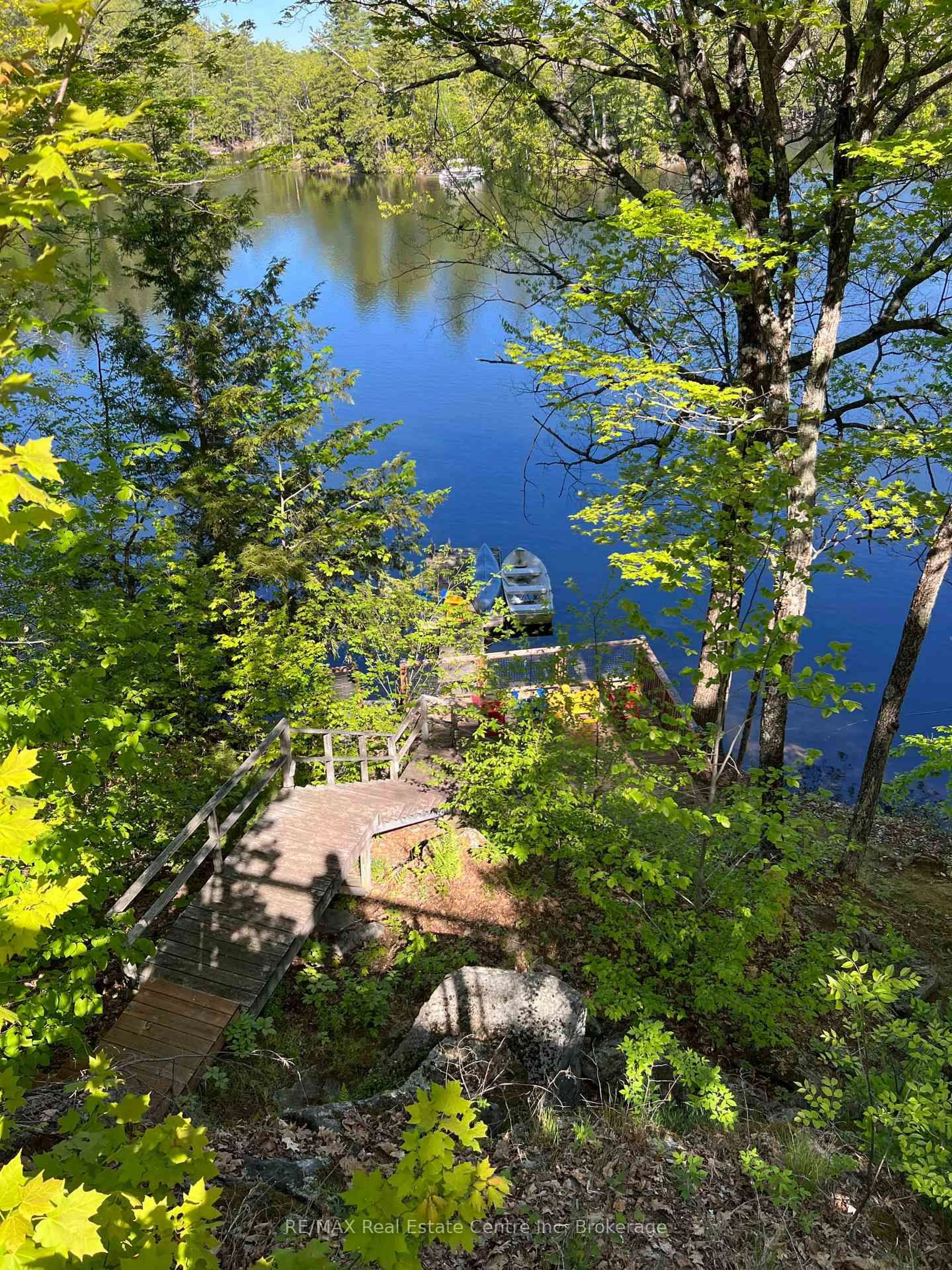A pic from outside/outdoor area/front of a property/back of a property/a pic from drone, water/lake/river/ocean view for 30 Pine Cone Lane, Bath Ontario K0H 1G0