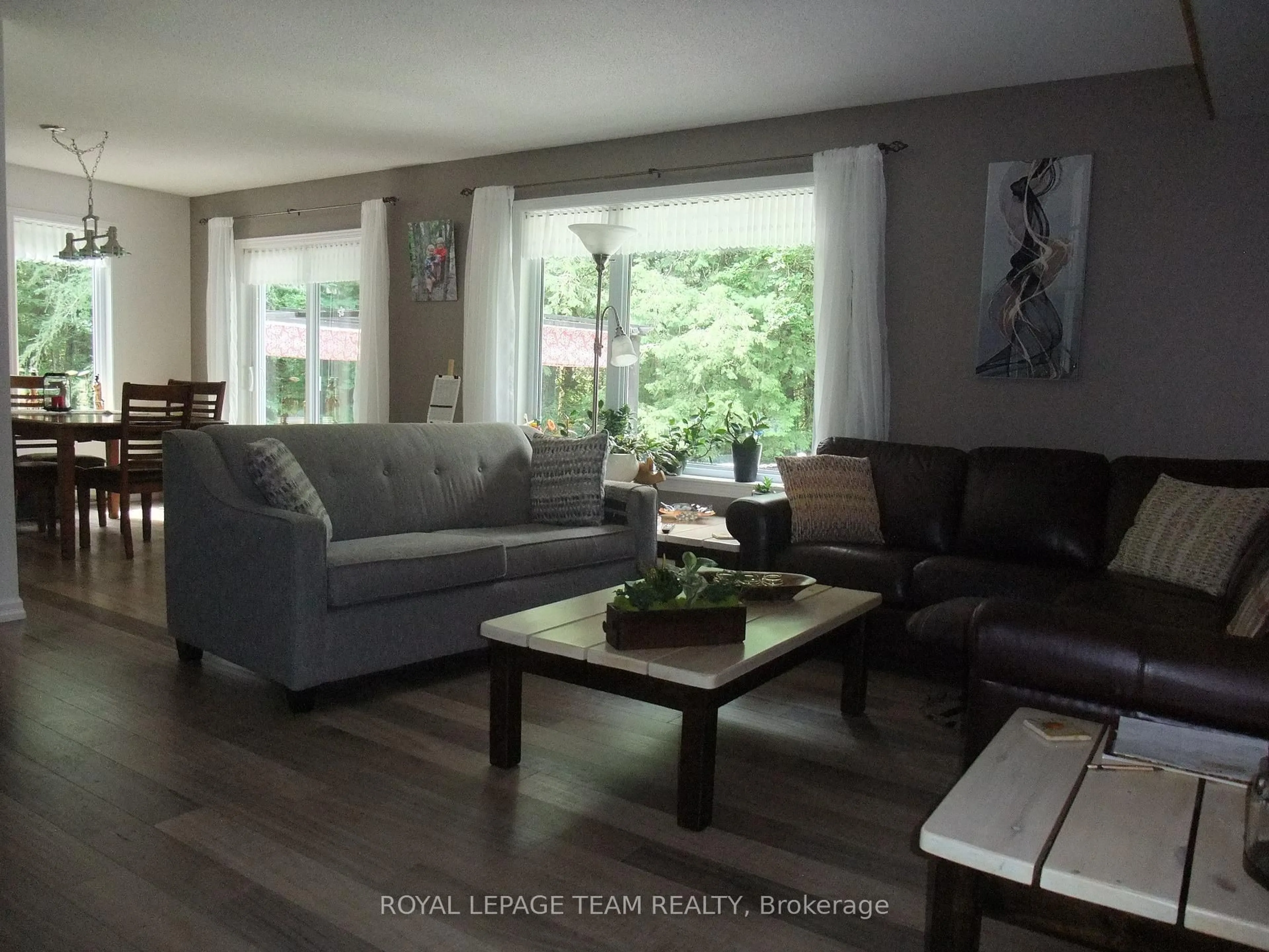 Living room with furniture, wood/laminate floor for 1563 Goshen Rd, Renfrew Ontario K7V 3Z5