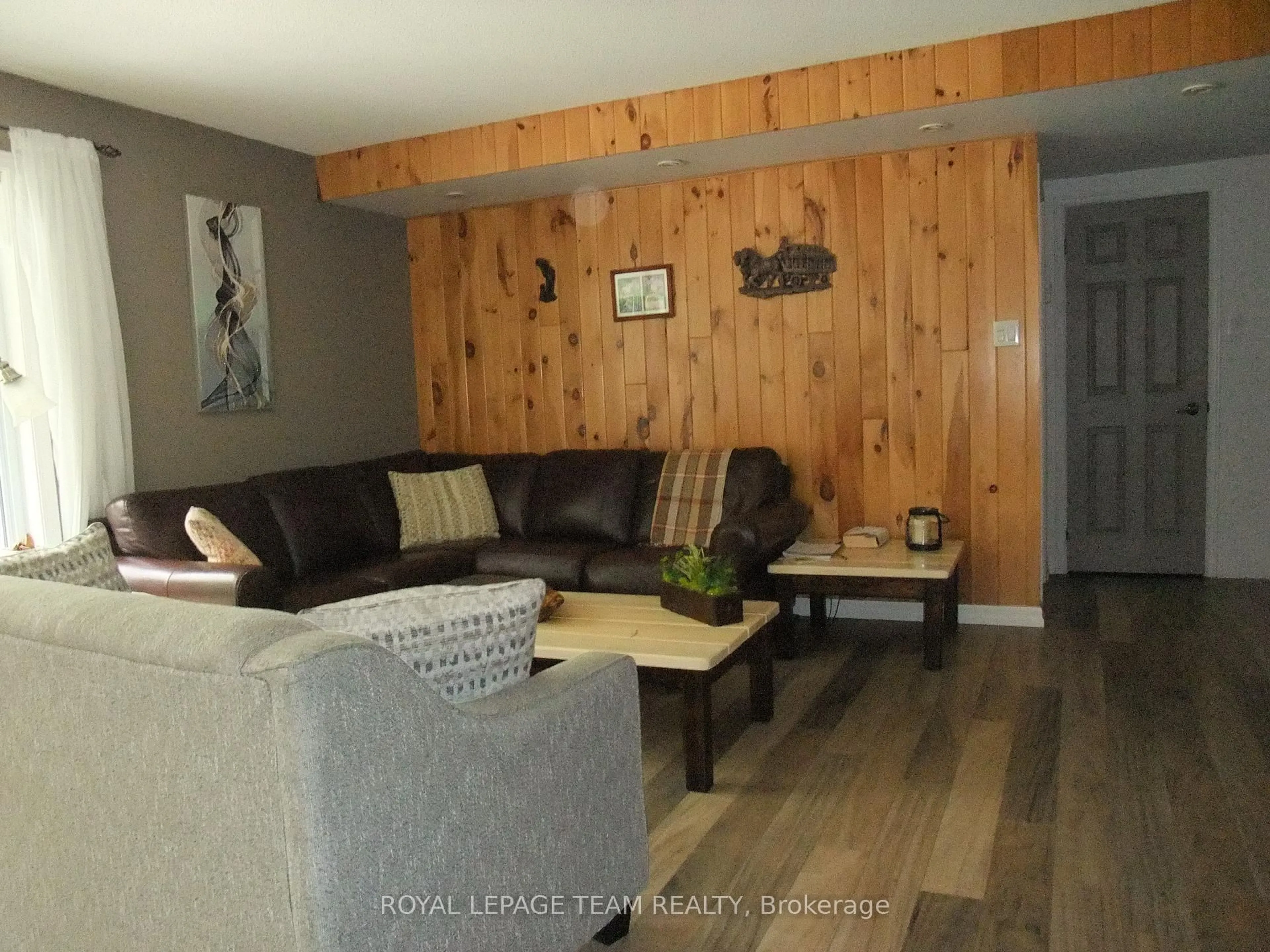 Living room with furniture, wood/laminate floor for 1563 Goshen Rd, Renfrew Ontario K7V 3Z5