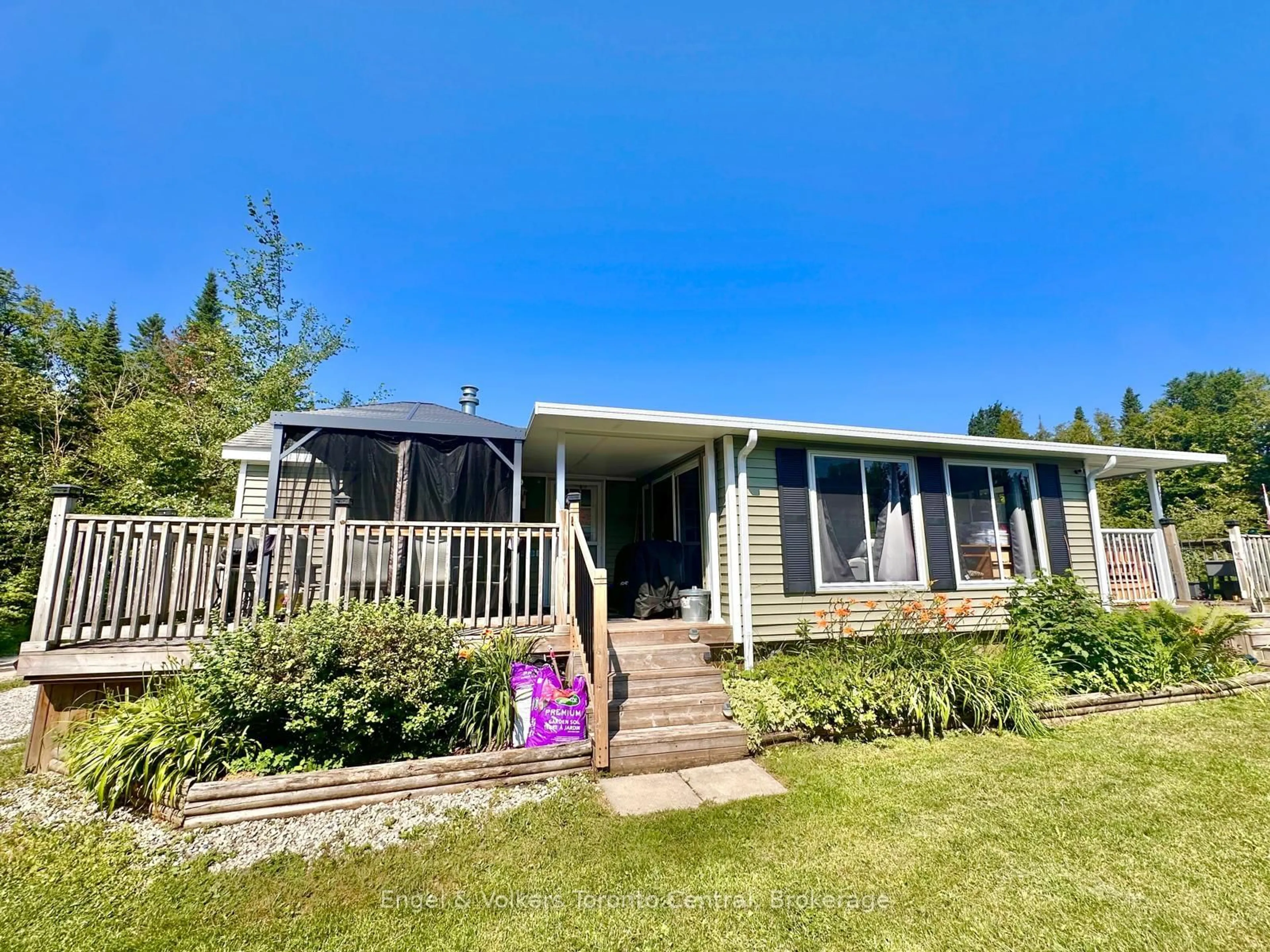 A pic from outside/outdoor area/front of a property/back of a property/a pic from drone, unknown for 7489 SIDEROAD 5 #T113, Wellington North Ontario N0G 2L0