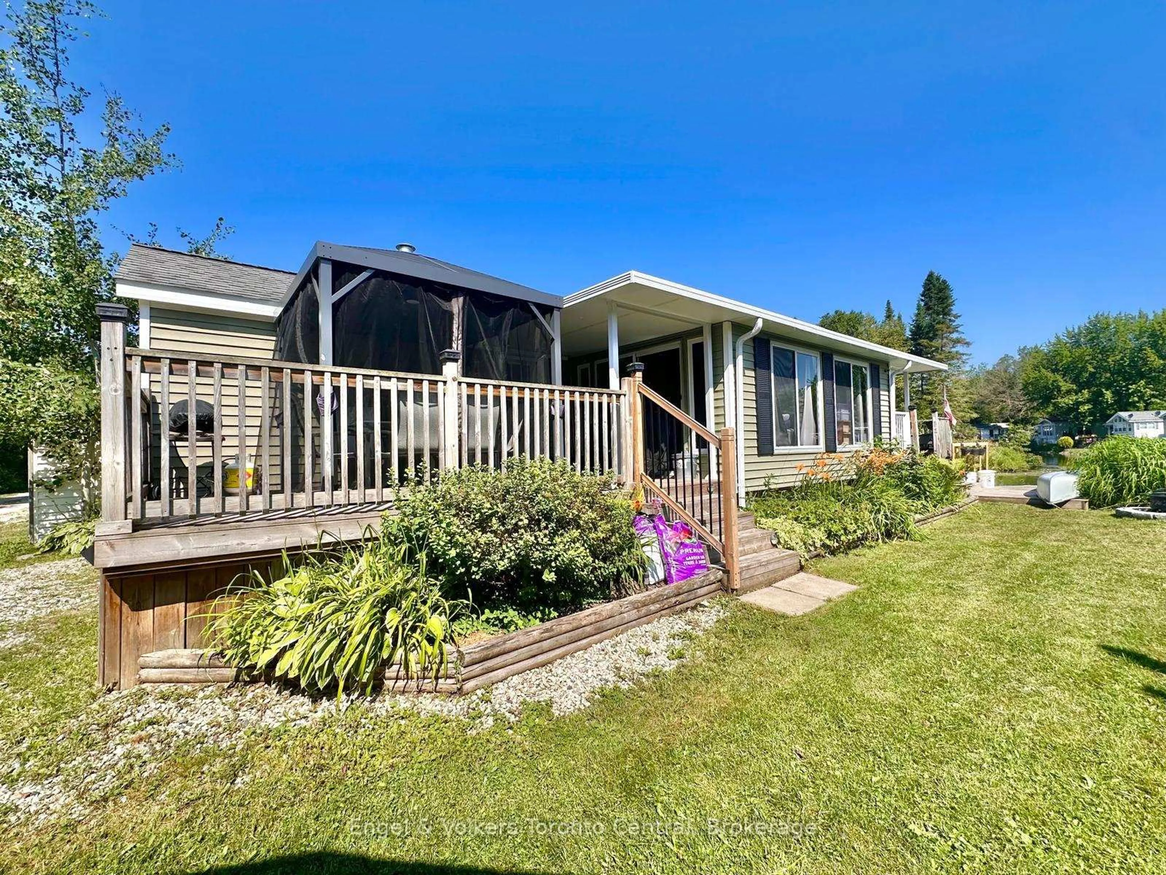 A pic from outside/outdoor area/front of a property/back of a property/a pic from drone, water/lake/river/ocean view for 7489 SIDEROAD 5 #T113, Wellington North Ontario N0G 2L0