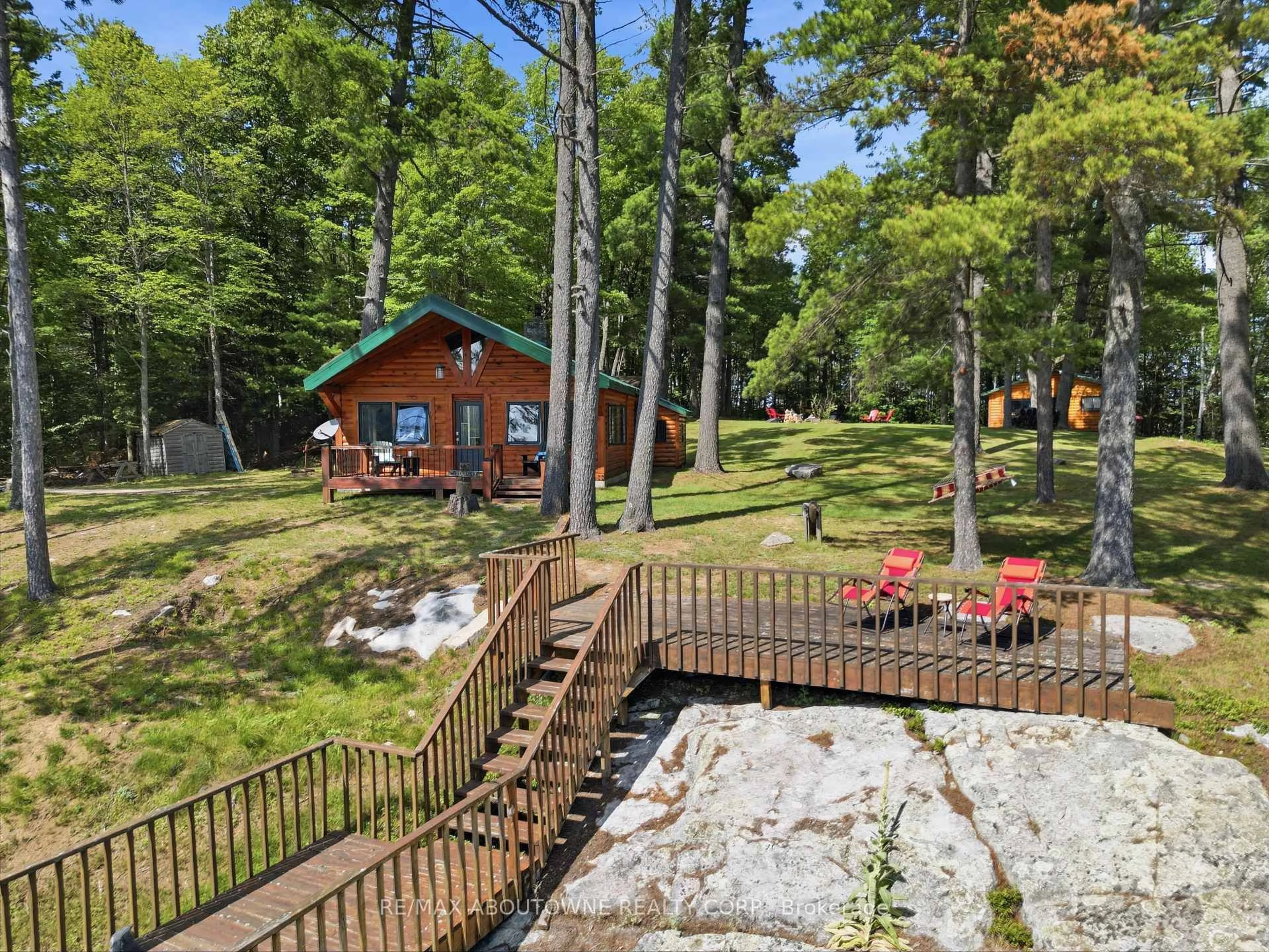 A pic from outside/outdoor area/front of a property/back of a property/a pic from drone, forest/trees view for 370 Fraser Lake, Bancroft Ontario K0L 1C0
