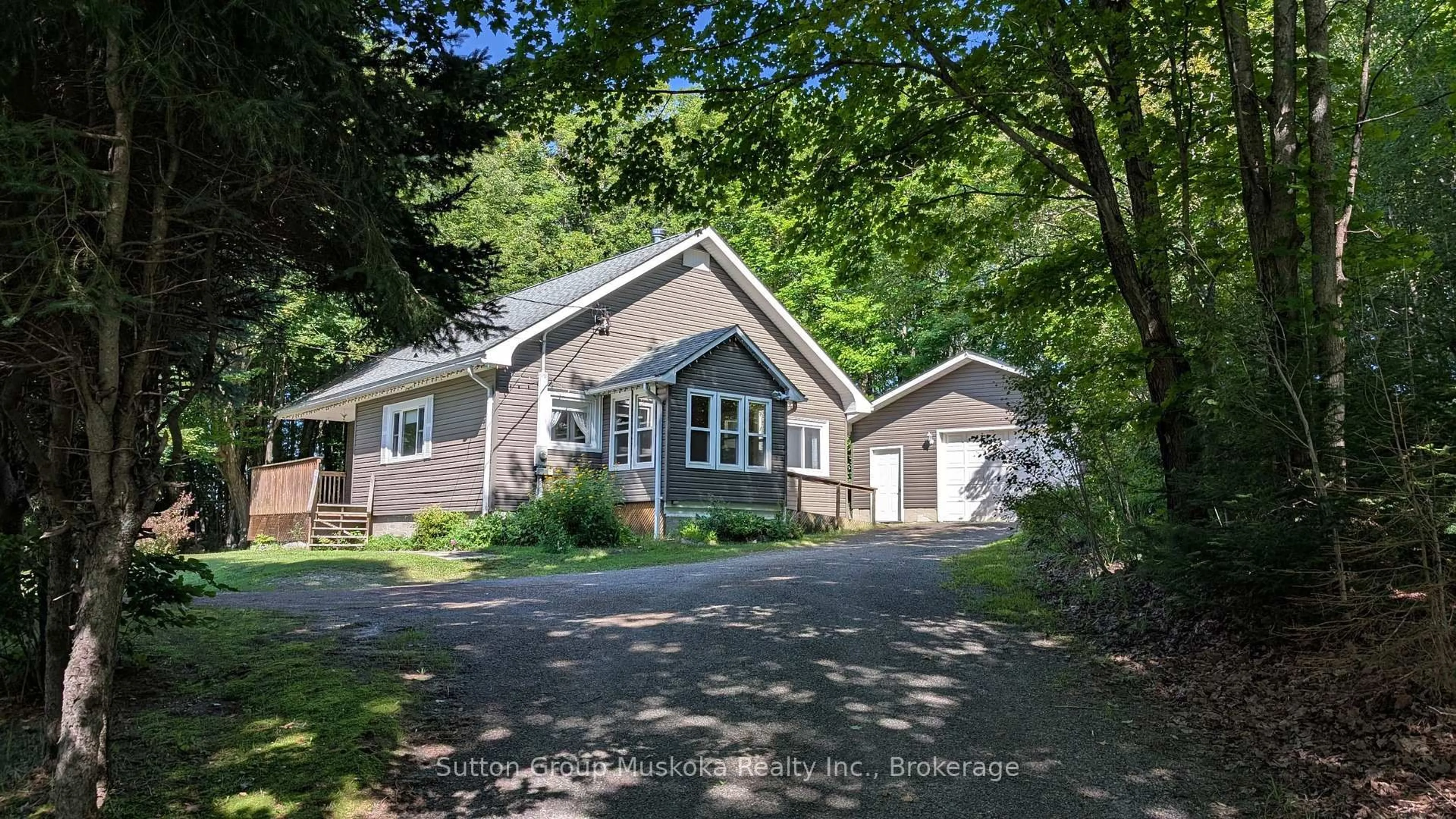 A pic from outside/outdoor area/front of a property/back of a property/a pic from drone, street for 66 Hanes Rd, Huntsville Ontario P1H 1M3
