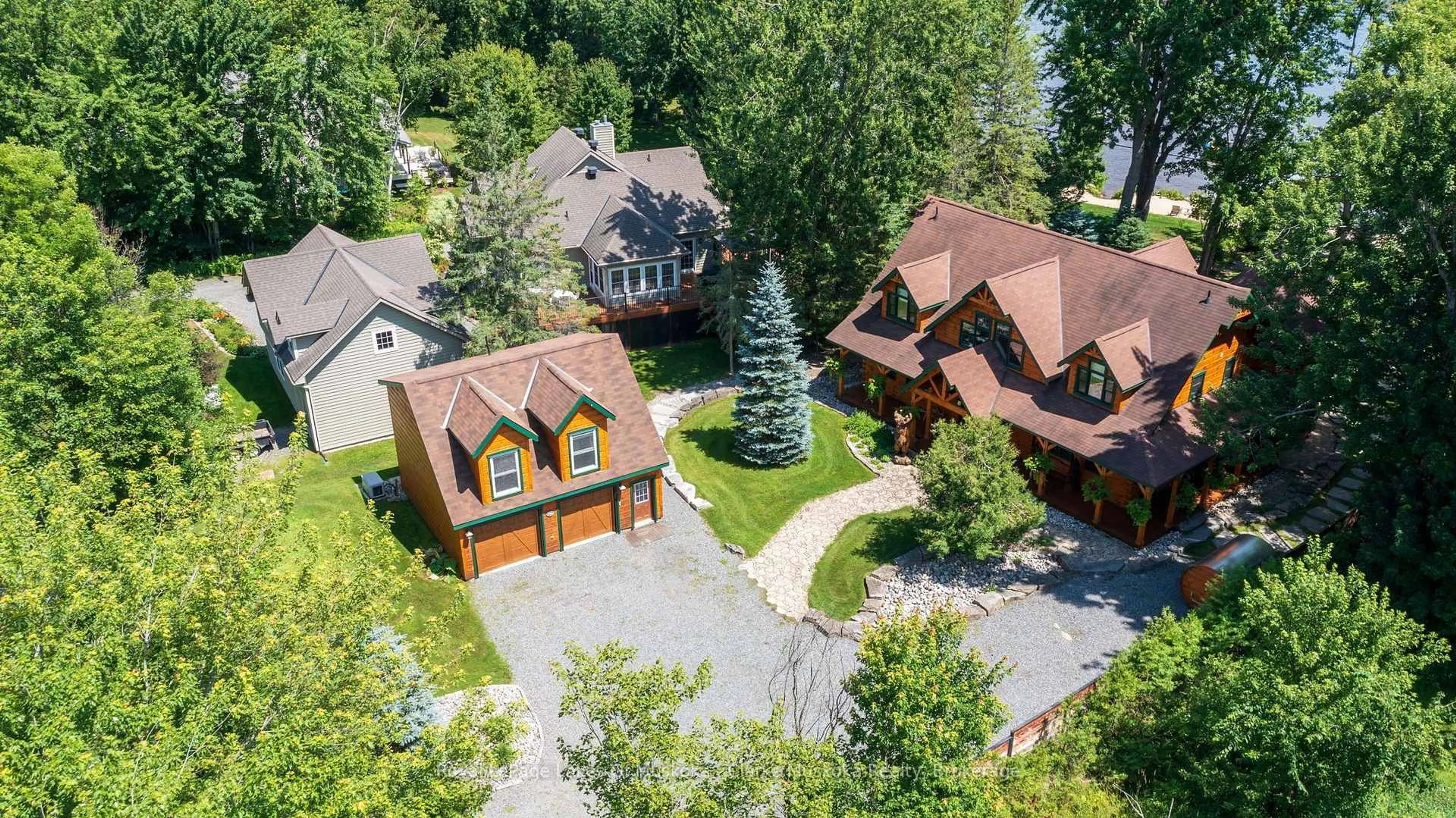 A pic from outside/outdoor area/front of a property/back of a property/a pic from drone, street for 1040 7TH HEAVEN Lane, Bracebridge Ontario P1L 1X2