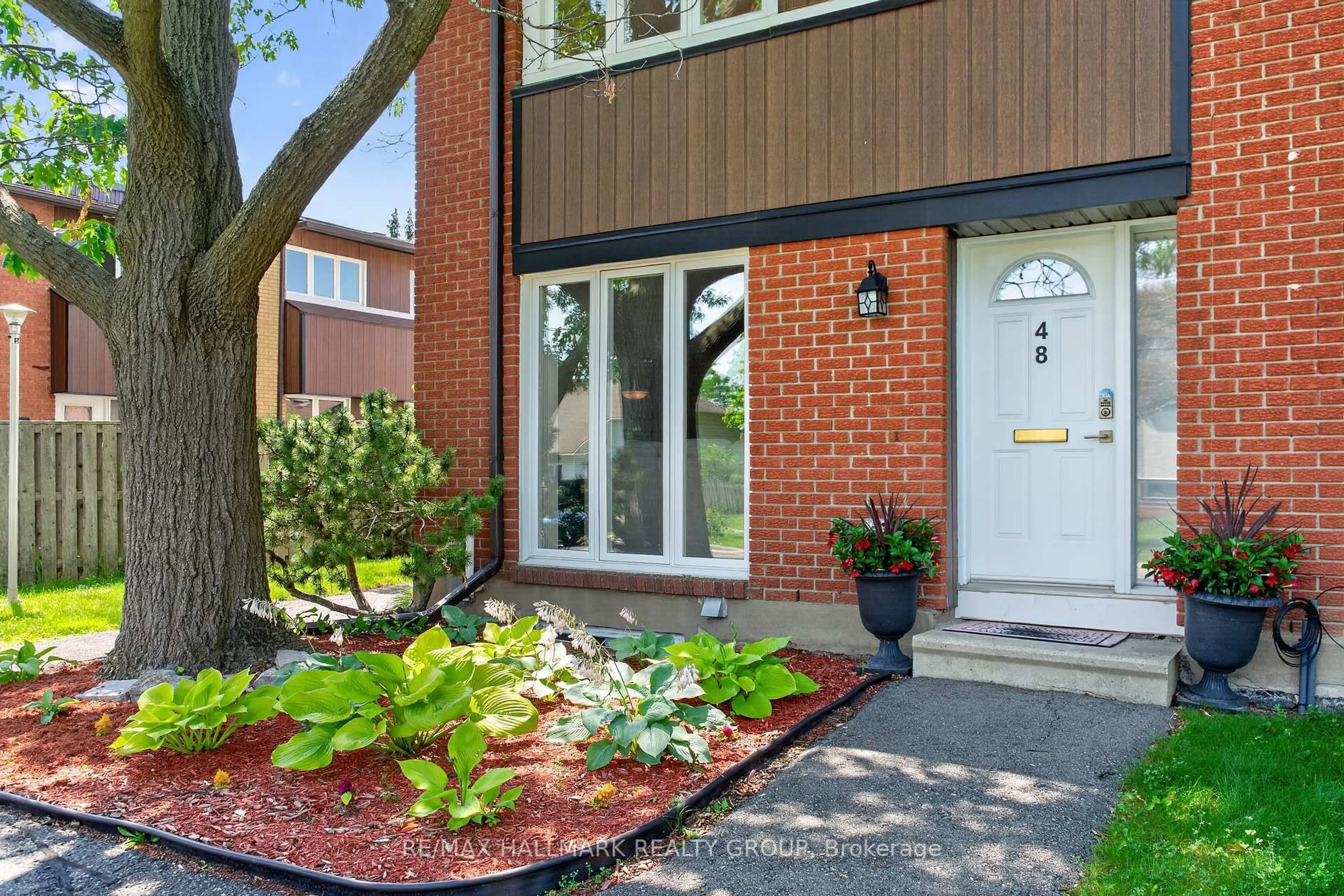 Home with brick exterior material, street for 1900 Marquis Ave #48, Ottawa Ontario K1J 8J2
