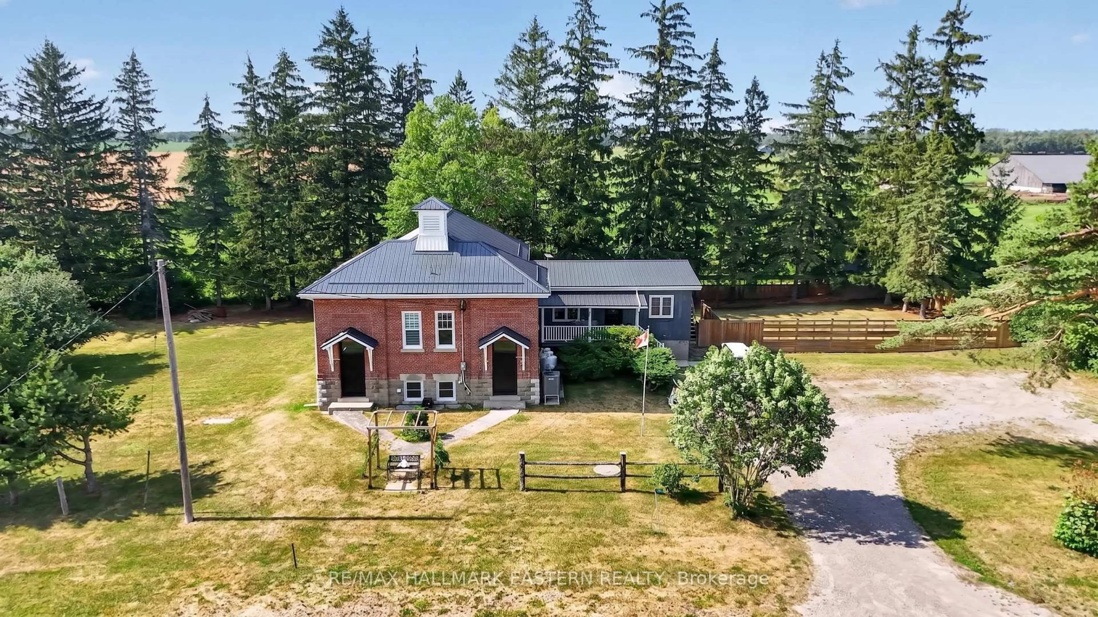 A pic from outside/outdoor area/front of a property/back of a property/a pic from drone, building for 1231 Highway 7, Kawartha Lakes Ontario K0M 2M0