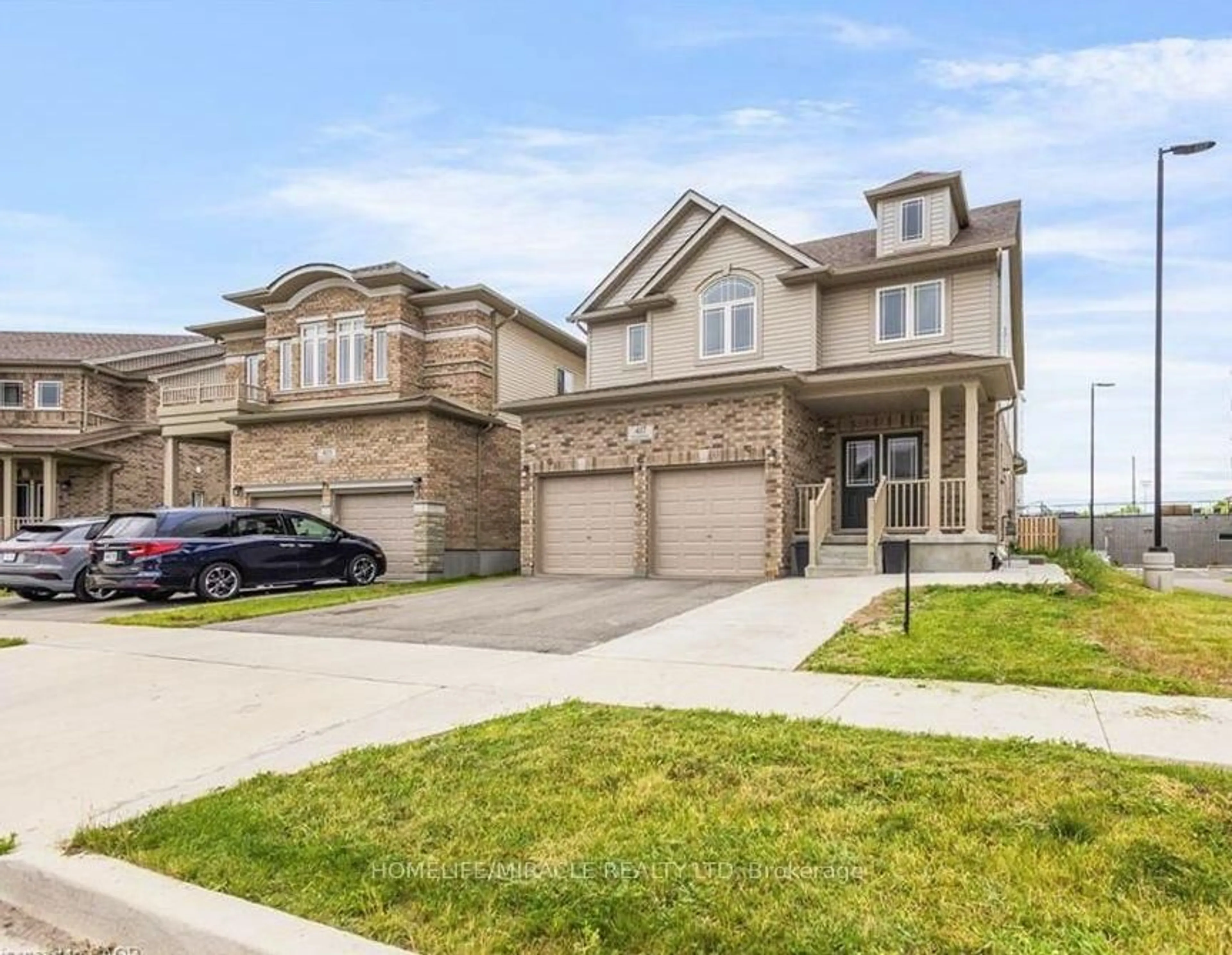 Home with brick exterior material, street for 417 RIVERTRAIL Ave, Kitchener Ontario N2A 0K2