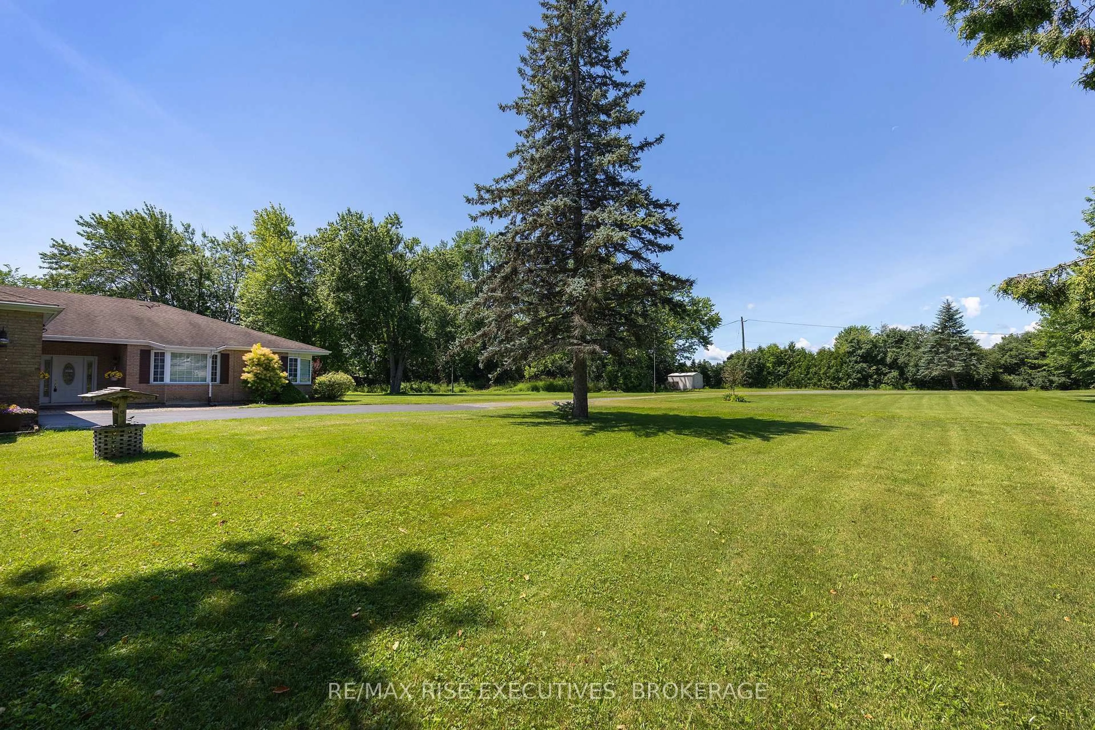 A pic from outside/outdoor area/front of a property/back of a property/a pic from drone, water/lake/river/ocean view for 5054 Lower Round Lake Rd, Battersea Ontario K0H 1H0