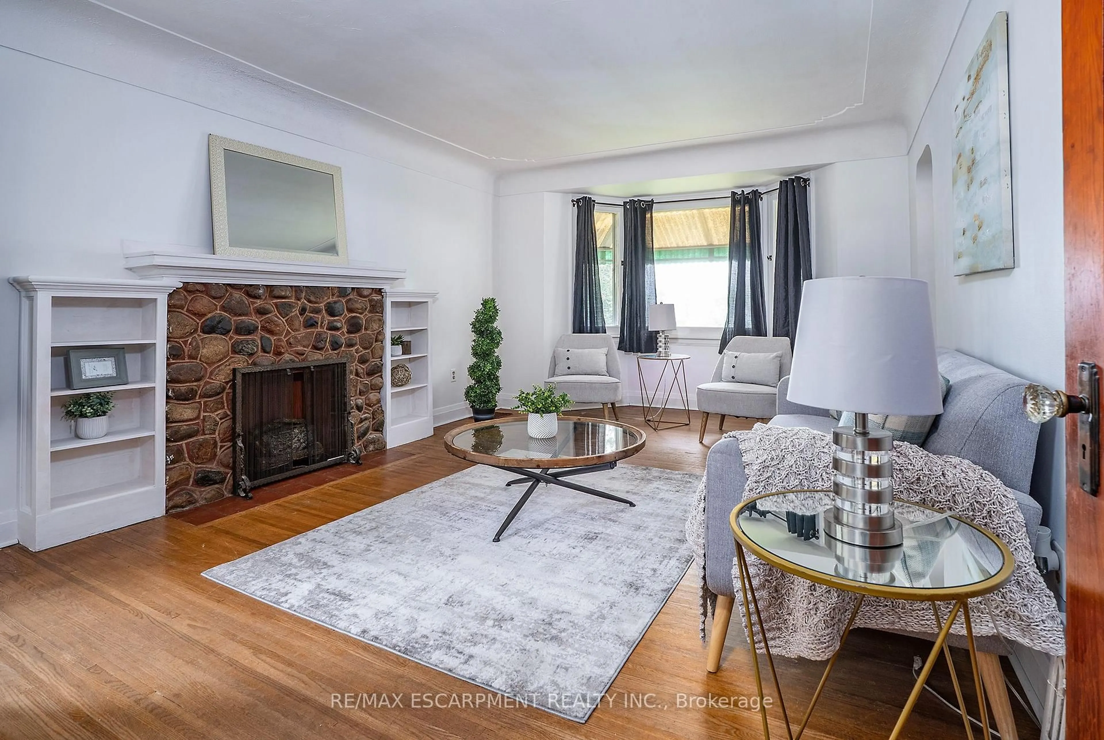 Living room with furniture, wood/laminate floor for 90 Osler Dr, Hamilton Ontario L9H 4B5
