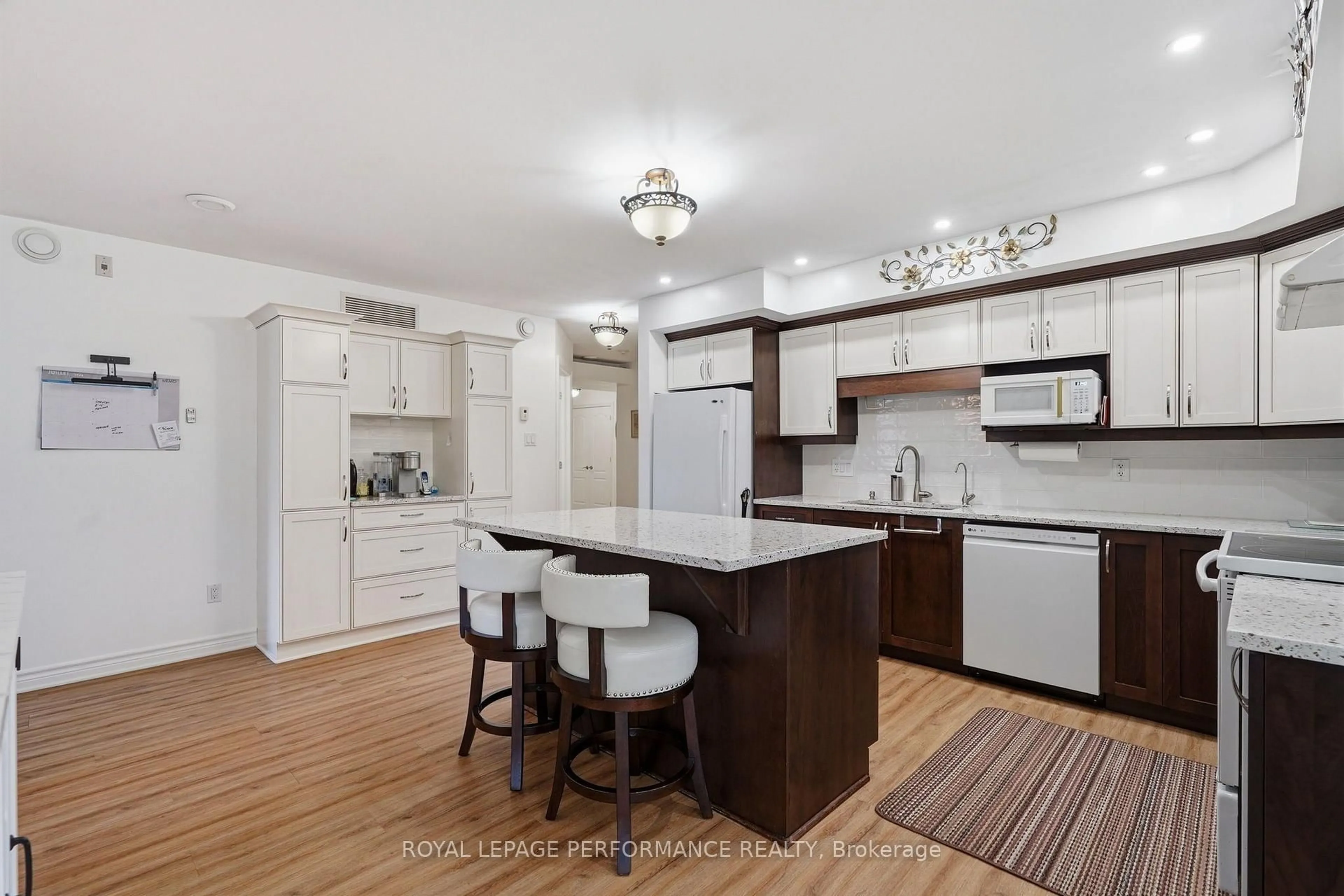 Open concept kitchen, wood/laminate floor for 770 Principale St #304, Casselman Ontario K0A 1M0