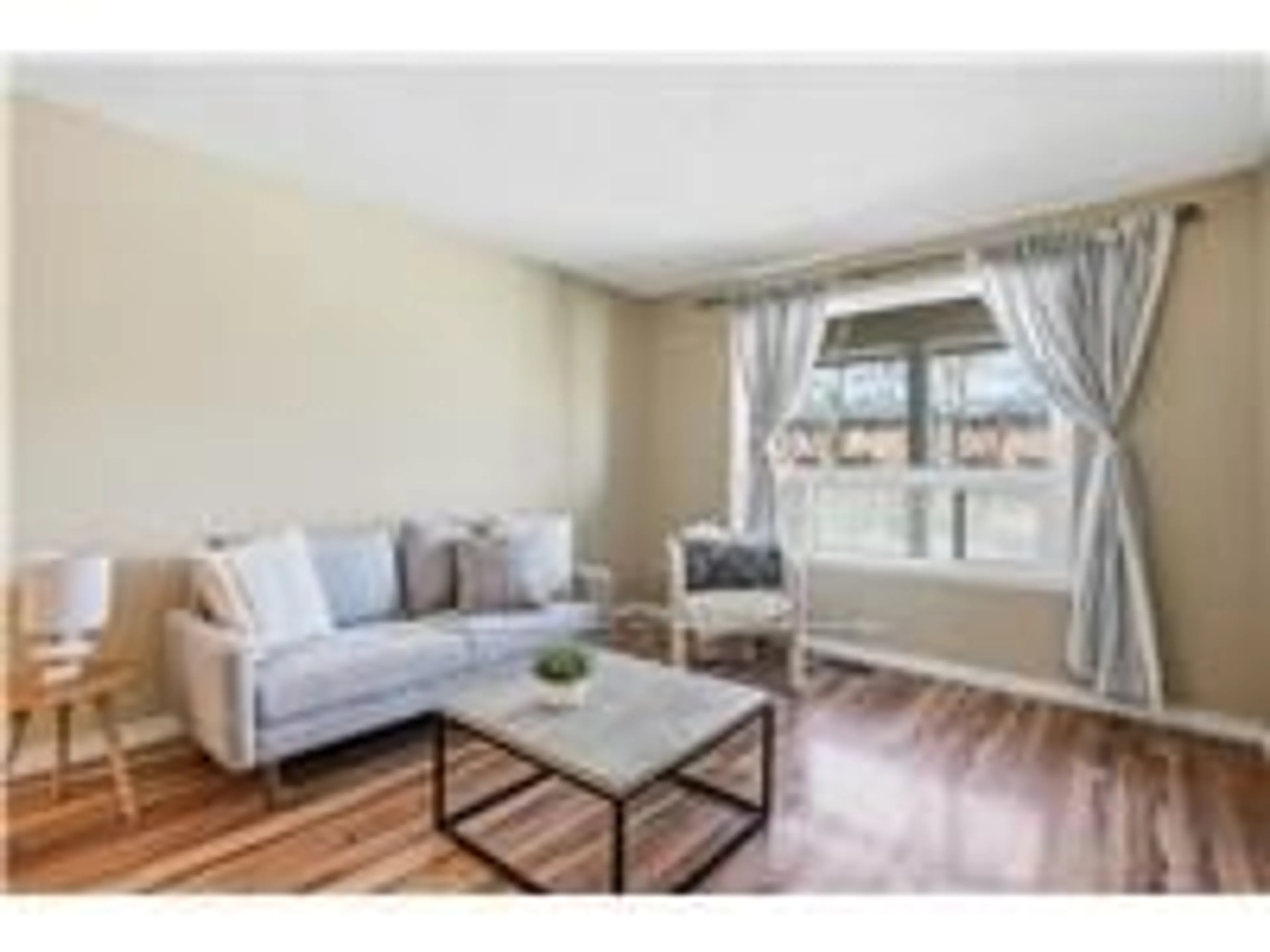 Living room with furniture, wood/laminate floor for 94 WENDOVER Dr, Hamilton Ontario L9C 5X5