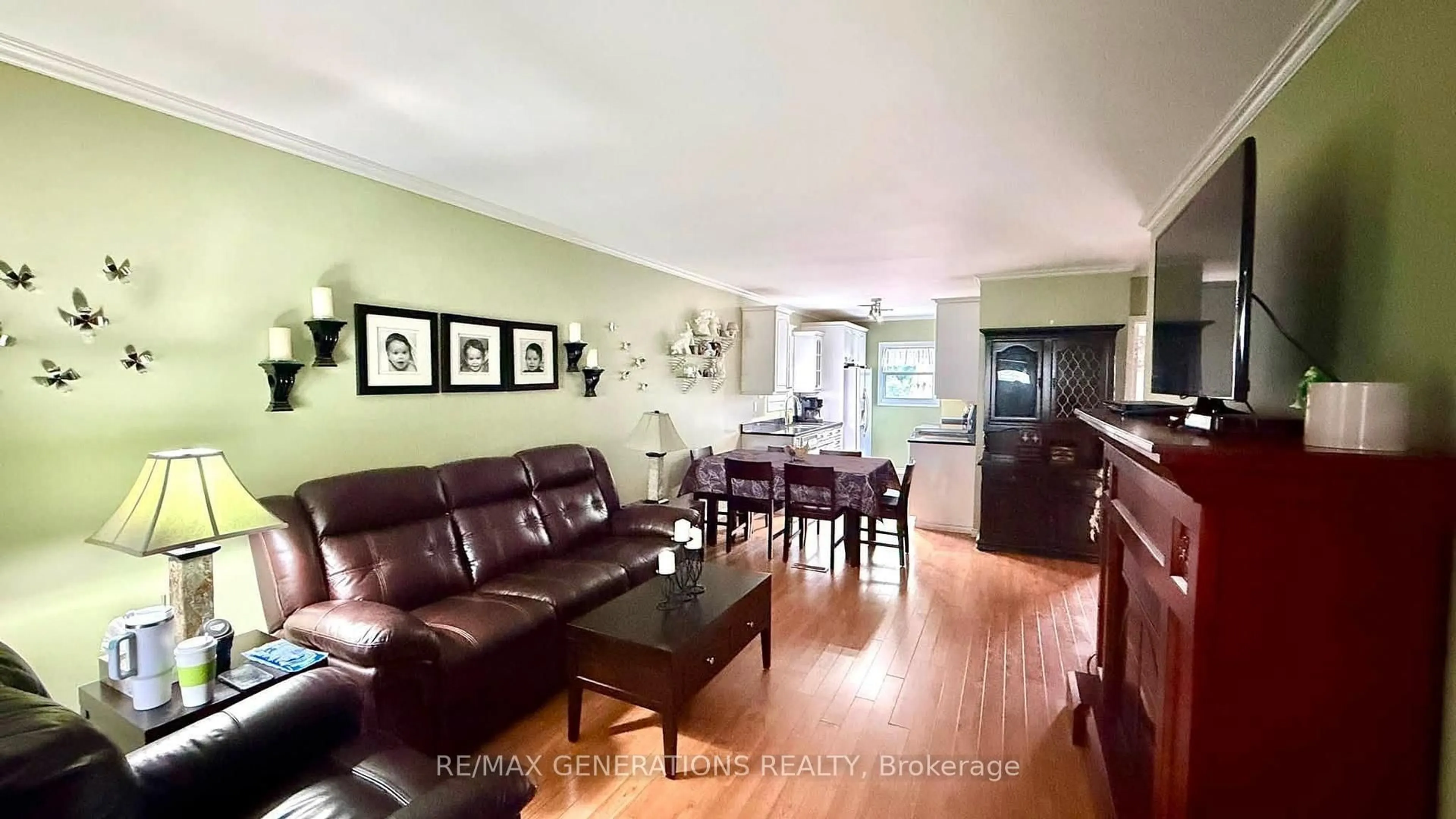 Living room with furniture, wood/laminate floor for 149 Prospect Ave, Thunder Bay Ontario P7A 5L5