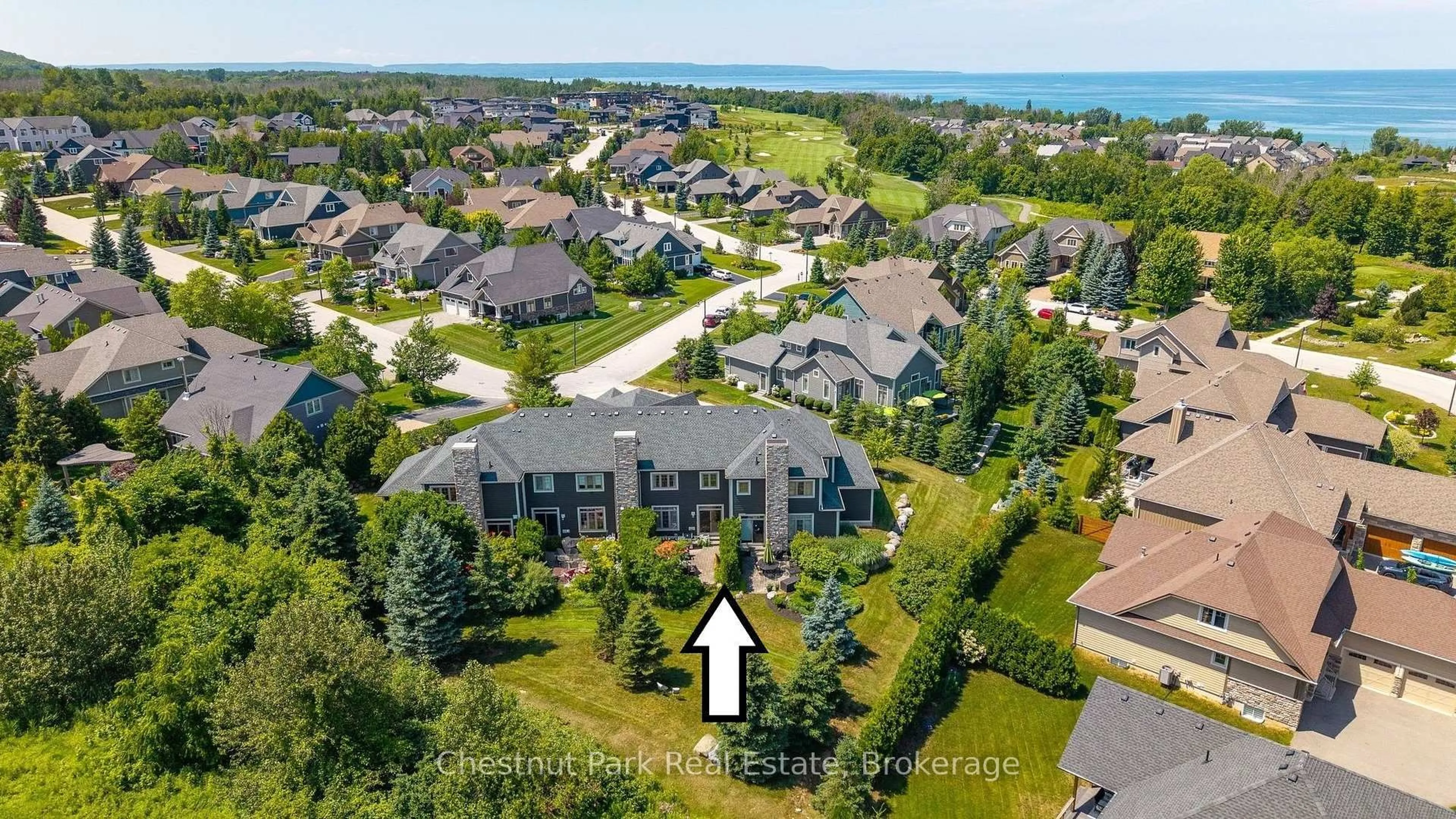 A pic from outside/outdoor area/front of a property/back of a property/a pic from drone, water/lake/river/ocean view for 108 Landry Lane #3, Blue Mountains Ontario N0H 2P0