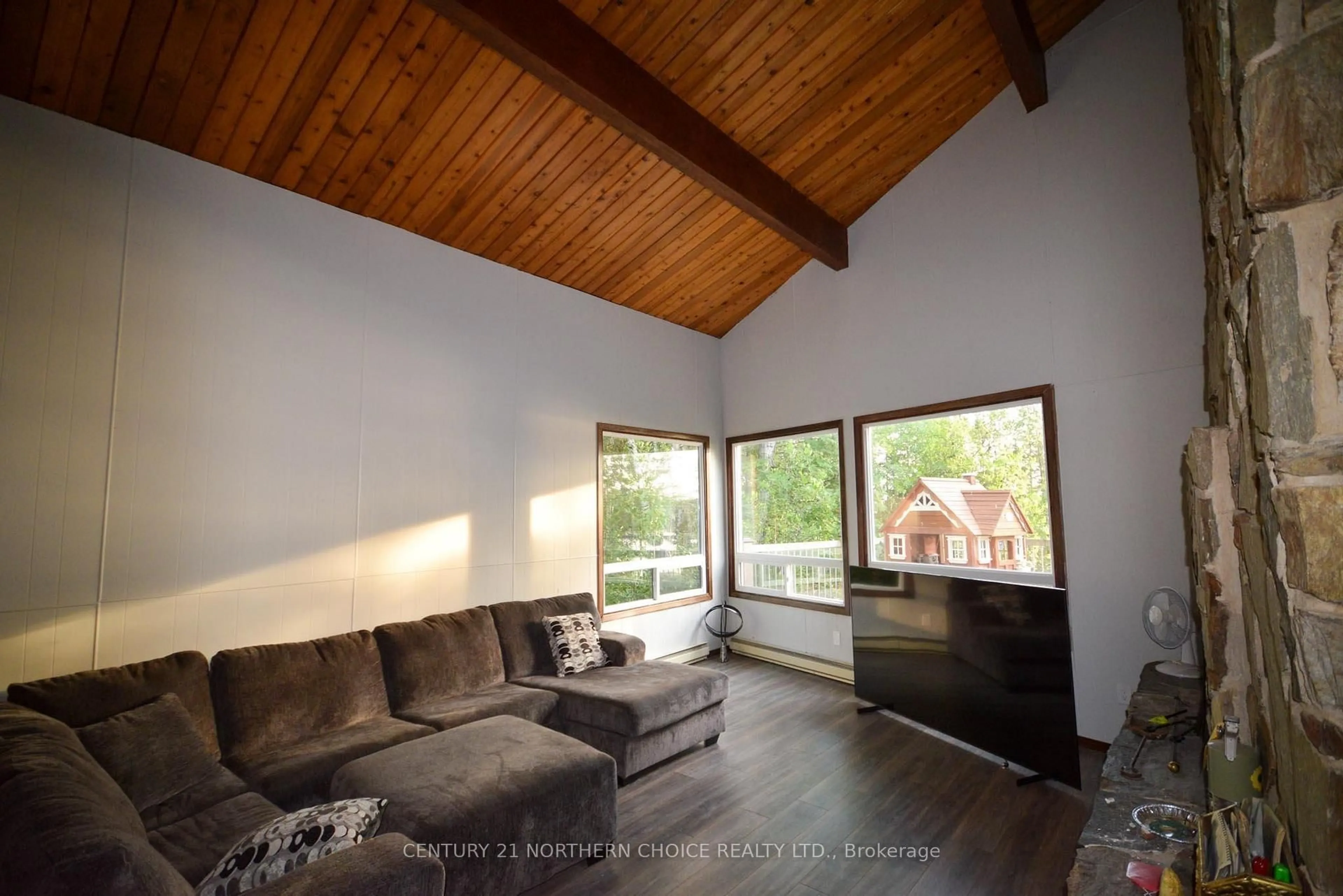Living room with furniture, wood/laminate floor for 75 Black Bear Rd, Kenora Remote Area Ontario P0X 1E0