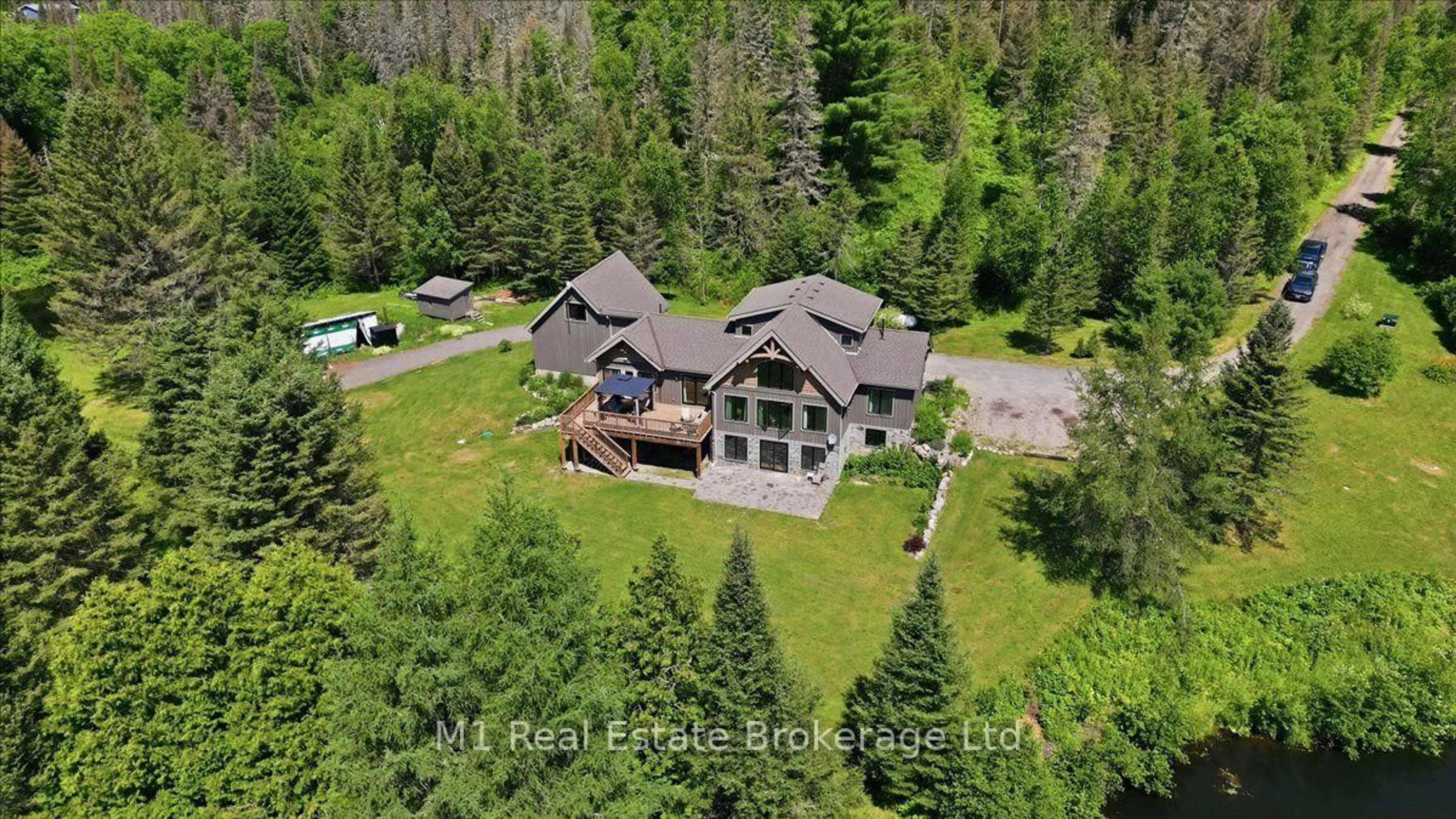 A pic from outside/outdoor area/front of a property/back of a property/a pic from drone, unknown for 76 Chalet Rd, Powassan Ontario P0H 2L0