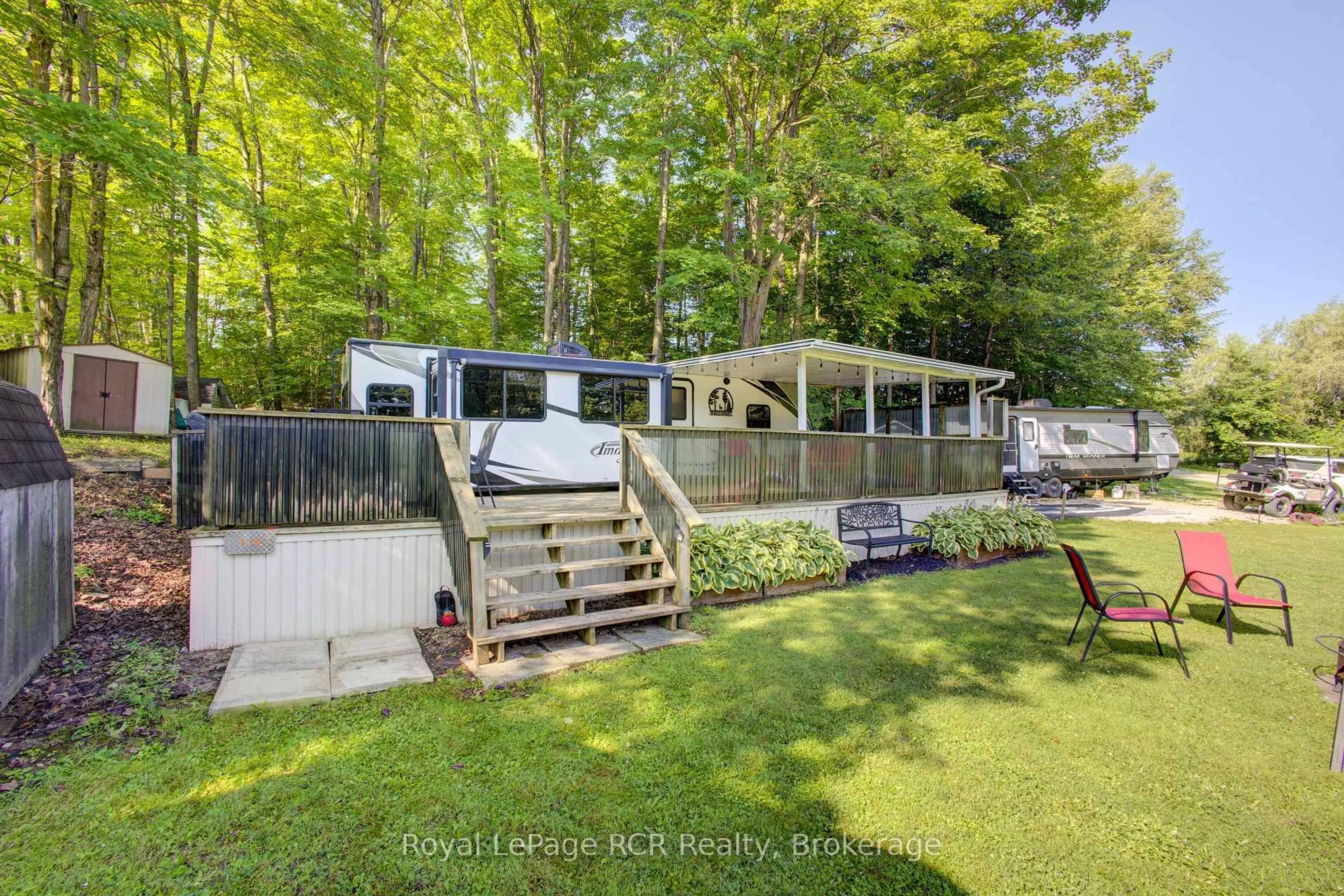 A pic from outside/outdoor area/front of a property/back of a property/a pic from drone, water/lake/river/ocean view for 142571 35 Rd #Site 119, West Grey Ontario N0G 1C0